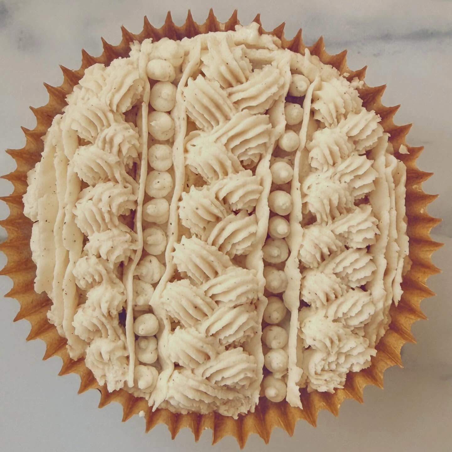 Only 14 inches of snow in Boston today (at least so far ❄️). To celebrate the occasion, I made a couple of snow‑inspired treats—snuggly sweater cupcakes frosted in chai‑spiced buttercream and sweet, crispy butter cookie snowflakes. How did you enjoy this snowy day?