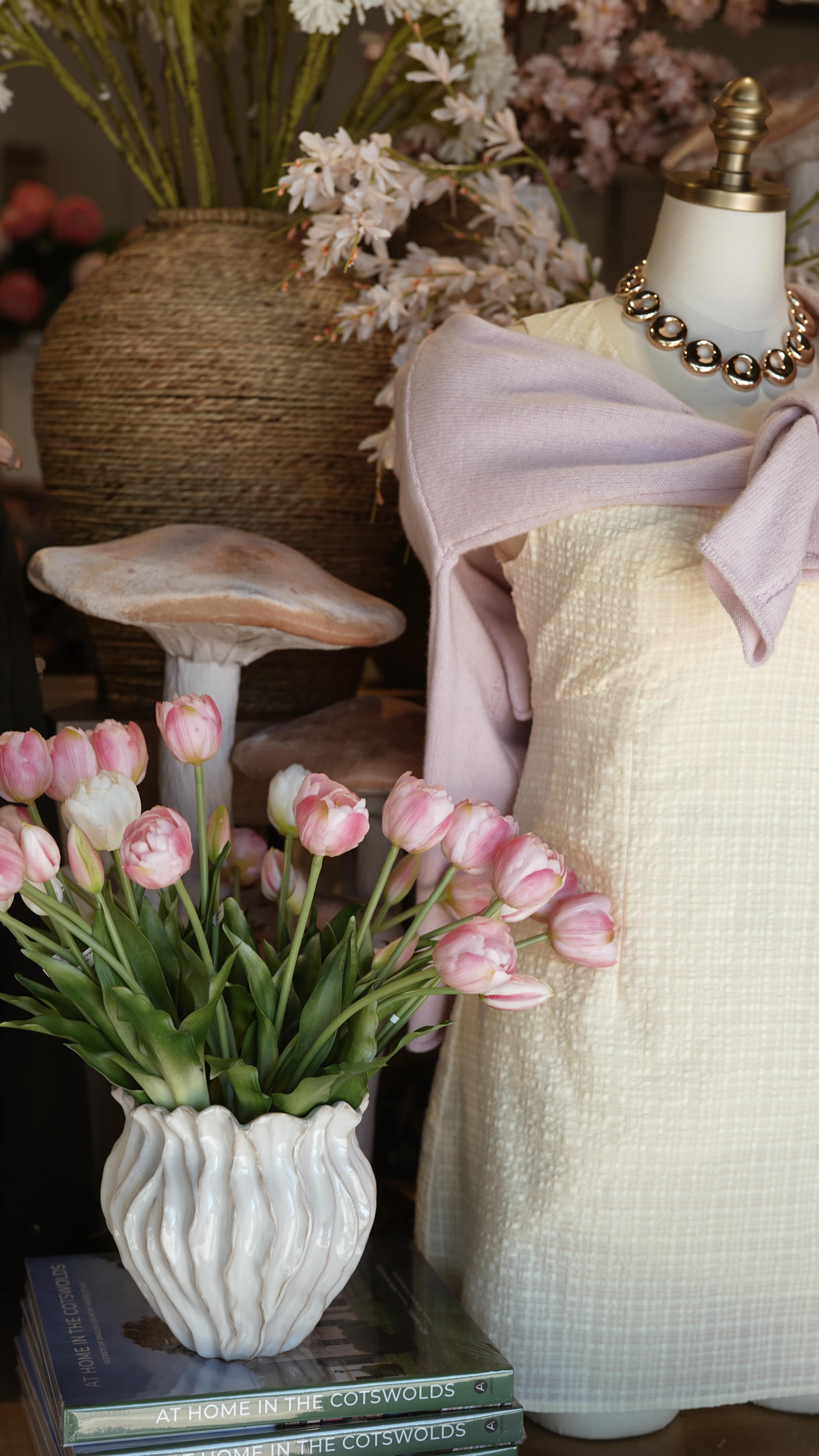 Here’s how we made one of my favorite displays 🍄 We were given a couple of these mushrooms and a gorgeous sunny morning, so we made SPRING HAPPEN 🌷We added as many florals as we could fit, and lots and lots of GREEN. AND our best selling cardigans are back in so many great spring colors! Including what Alexis & I are both wearing ✨🧚♀️