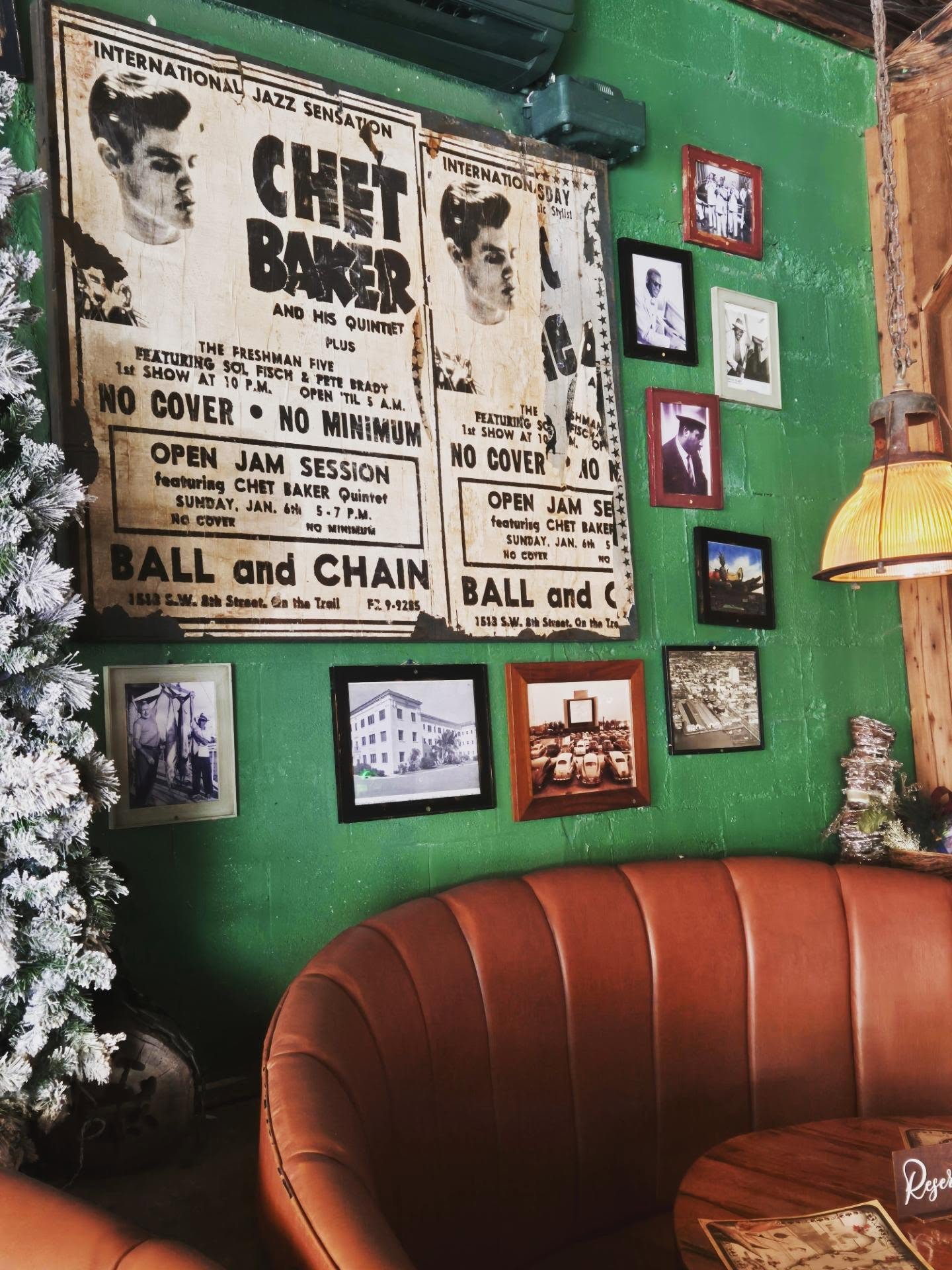 Miami’s most compelling rooms aren’t found along the water. They’re tucked into neighbourhoods where history still dictates the mood.
At Ball & Chain in Little Havana, the architecture does half the storytelling. Vaulted wooden ceilings, emerald walls dense with archival photographs, posters of jazz greats who once commanded the stage. It feels less like a revival and more like continuity — a space that never surrendered its identity.
I arrived before dusk, when the light is generous and the bar hums rather than roars. A well-built rum cocktail, crisp and exacting, set the tone. The menu leans Cuban, assured and deeply flavoured — dishes that prioritize depth over decoration. Nothing is overwrought. Everything is intentional.
As evening settled, the tempo shifted almost imperceptibly. Conversations thickened, music rose, the room recalibrated. This is what Miami does best when it resists spectacle: it seduces slowly.
There are flashier reservations in the city. Fewer with this kind of provenance.