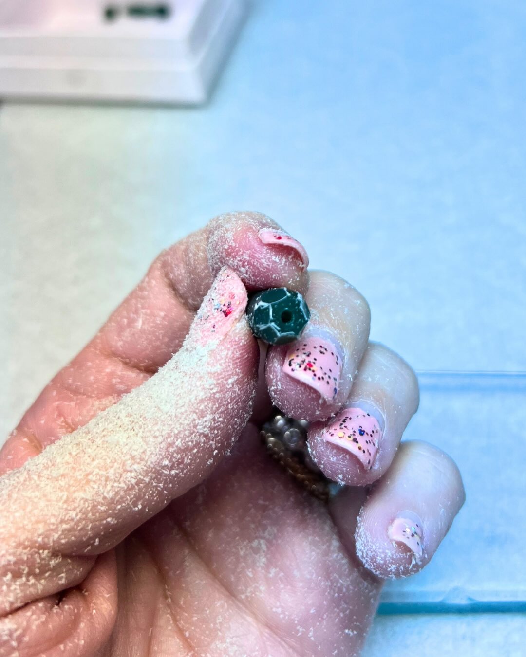 The foundation for the Facet Collection starts with the hand filed beads, 9 variations, inspired by the facets and planes of gemstones 💎. Here’s a peek at the process:
✨
1) Holding one of the original wax beads, fine wax dust on my hands from filing the facets from a small block of wax.
2) a completed wax model of the medium flat bead.
3) all 9 faceted bead wax model variations spruced up and ready for casting.
4) a rough silver casting (bottom) and polished (top) bead
5) video showing a 360 view of a completed wax model faceted bead
6) the medium barrel bead cast in silver
✨
Which process photo is your favorite? 🤩
Visit mejiajewelry.com to shop. Message me with questions anytime.