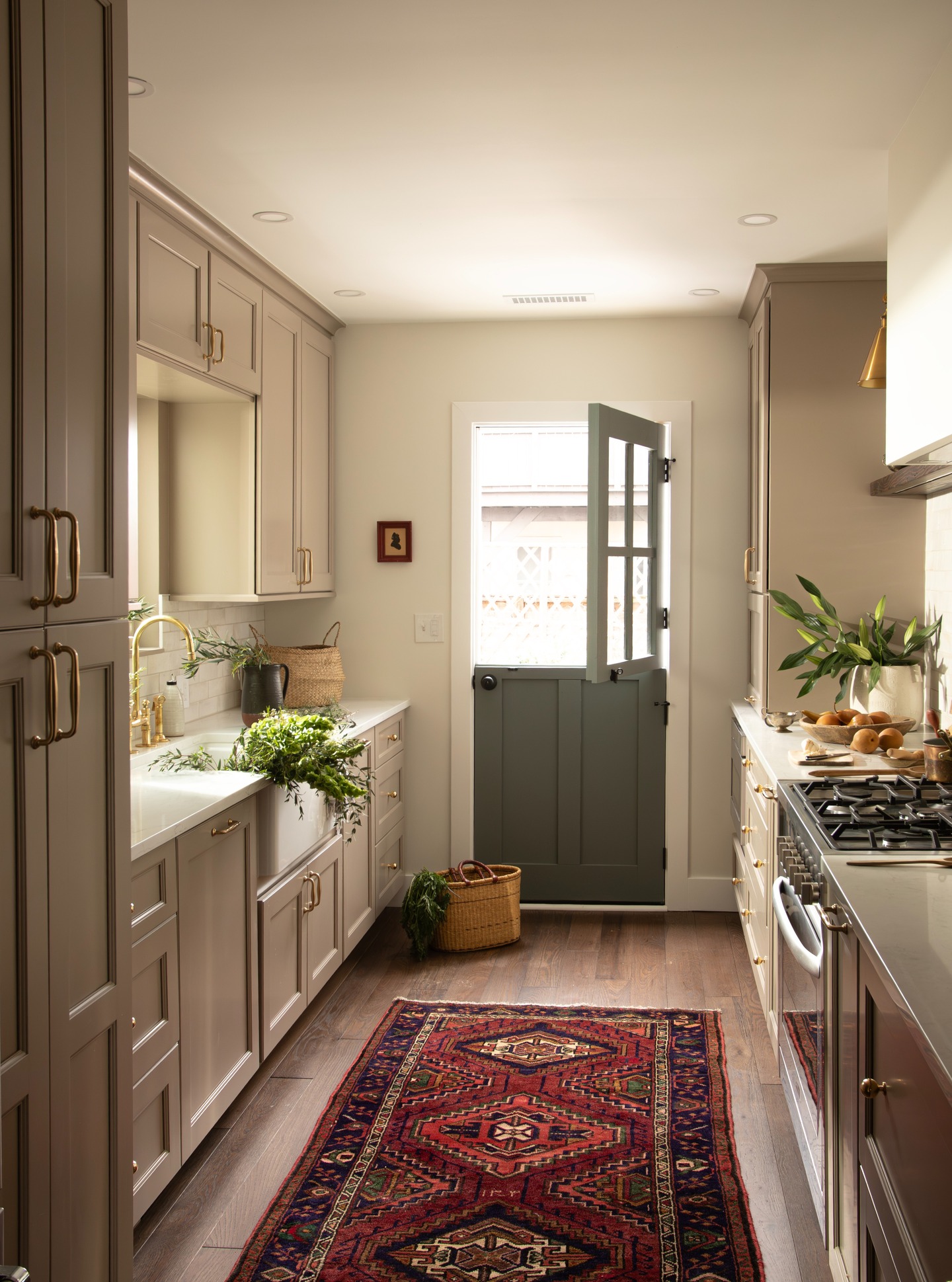 Hello gorgeous! We love a good transformation story, especially the stealth beauty waiting in the shadows for their moment to shine. This little Fells Point kitchen in a 1900’s row house just wasn’t living up to her potential. The layout felt clunky, the finishes were dated, and the connection to the back outdoor area was awkward, so we sprinkled her with some magic dust, moved an exterior door here, widened the kitchen entry there... made the powder room more charming and efficient. Now she can finally breathe and enjoy herself! She's feeling calm, layered, a little moody and old fashioned, but in the best way.
Swipe left to see those before pics and brace yourself! This was a makeover for the books—read all the details on the blog. Link in bio. 😘
Designer: @jamiecampbellbynum
Builder: @theboxwoodcompany
Photography: @drurybynum
Vintage Rug: @carpetbeggarsrugs
#beforeandafter #kitchenrenovation #powderroomdesign #baltimoreinteriordesign