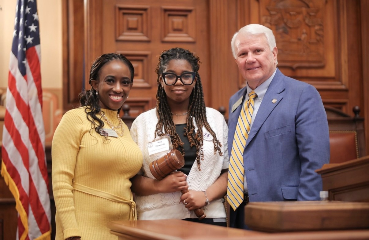 This week, I had the pleasure of welcoming a House Page, Kira, from my district on the floor at the Georgia State Capitol to witness the legislative process firsthand. At the end of her service, Kira also had the opportunity to take a photo with Jon Burns, Speaker of the House! 🏛️
The House Page Program is a great opportunity for middle and high school students to get an up-close look at how laws are made, meet state leaders, and experience a day in the life under the Gold Dome.
If you’re a student from House District 95, and interested in government, leadership, or public service, I encourage you to sign up to be a Page for a day!
We want to hear from you and make sure your voice is part of the future we’re building here in Georgia! Please email Jai Tazel at constituentrep@kendrickforgeorgia.com for more information.