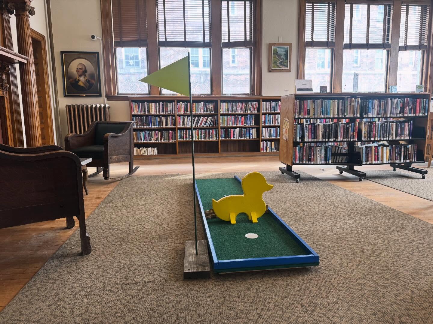 ⛳️ Mini golf in the library today from noon to 6pm. Come play a round!