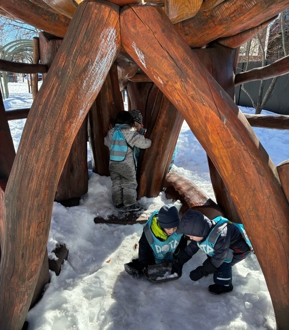 #POTAParenting This month during our staff meeting, our teachers participated in a drama workshop where we explored a surprisingly powerful element of drama: silence.
In drama, silence is never empty. It holds tension, anticipation and emotion. In those quiet moments, the audience is connecting, interpreting and making meaning of all they are seeing and hearing. Something deeper is happening.
Reflecting on this, we thought about how this mirrors early childhood.
Young children live in a world that is often filled with the noise of instructions, reminders, music, and schedules.
And yet, some of their most important growth happens in the quiet spaces.
When a child pauses before answering a question, something is forming.
When they sit silently with blocks, turning an idea over in their mind, something is building.
When they don’t immediately respond after a conflict, something is processing.
As adults, we sometimes feel pressure to fill the space and prompt, explain, correct, or entertain. But when we allow a moment of quiet, we communicate something powerful: I trust you. I believe something meaningful is happening inside you.
This week, let’s think about the sacred pause.
What happens when we wait three extra seconds before stepping in?
What do we notice when we resist answering our own question?
How does it feel to sit beside a child without rushing to fill the space?
Very often, what emerges from that silence is deeper thinking, richer language, creative problem-solving, or simply a sense of calm confidence.