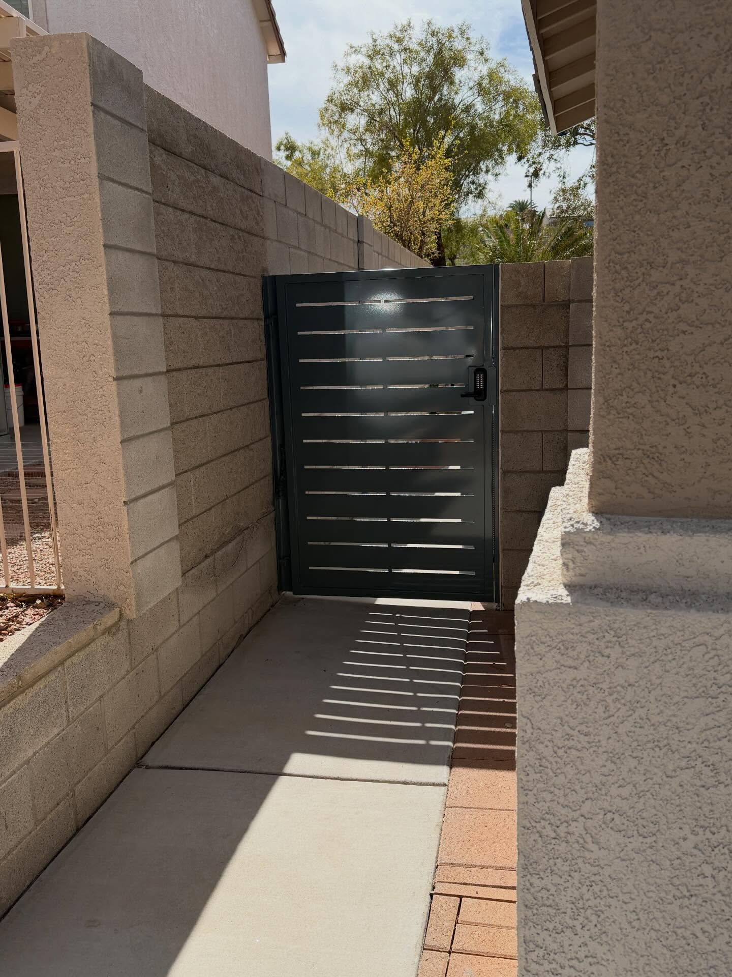 A pair of modern gates bring style, privacy, and security to this Seven Hills home, also keeping curious rabbits from devouring the lush gardens within. RAL7031