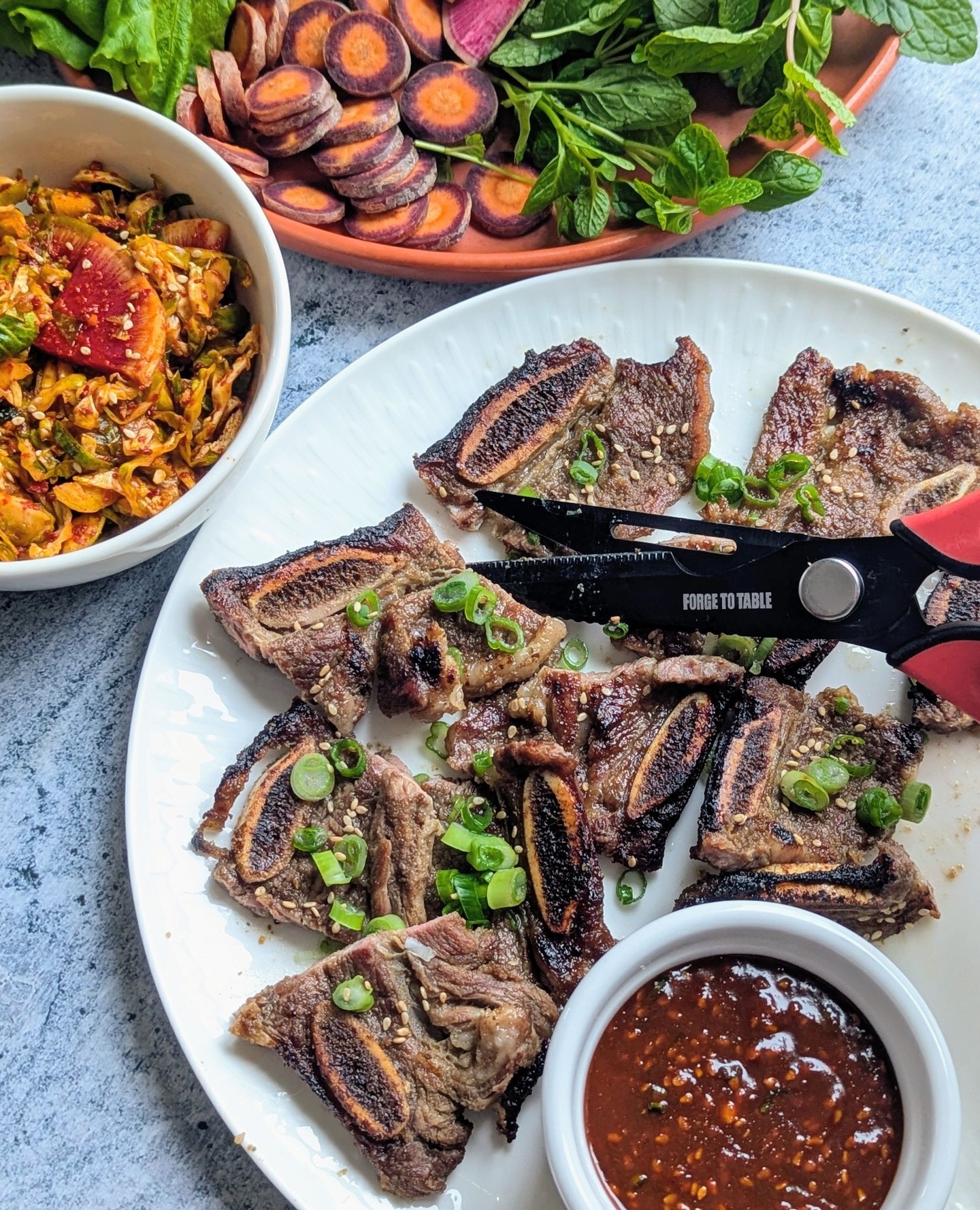 Of all the Korean BBQ options, this standout is sweet, savory, smoky, and irresistibly tender. Known as the LA-style, beef ribs are thin-cut, marinated, and cooked over high heat to perfection, right on the bone. Enjoy them with a platter of vegetables, dipping sauce, and a quick kimchi!
...
🔪 Titanium 7-in-1 Kitchen Shears
...
'Korean Galbi Beef Short Ribs with Quick Brussels Sprout Kimchi' recipe out now on our Test Kitchen!