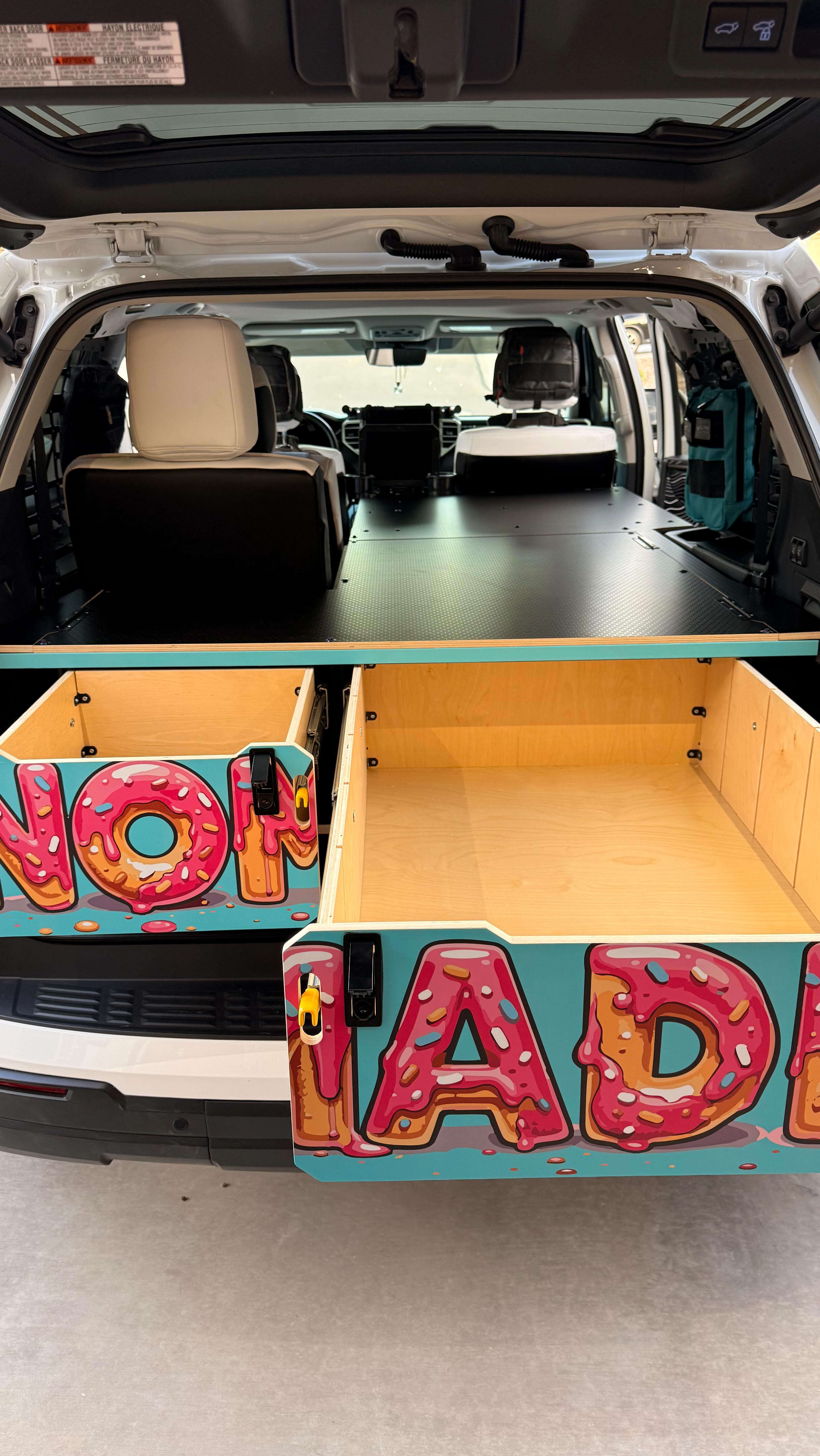 Who here likes donuts? 🍩
This 3rd gen Sequoia just got the full dessert treatment with a donut-inspired faceplate wrap.
But it’s not just about looks—we also added a bed platform extension giving you 6.5+ feet of sleeping space in the back. Perfect for camping trips, trail days, or emergency donut runs.
Alright… your turn:
What faceplate design would you run on your setup?