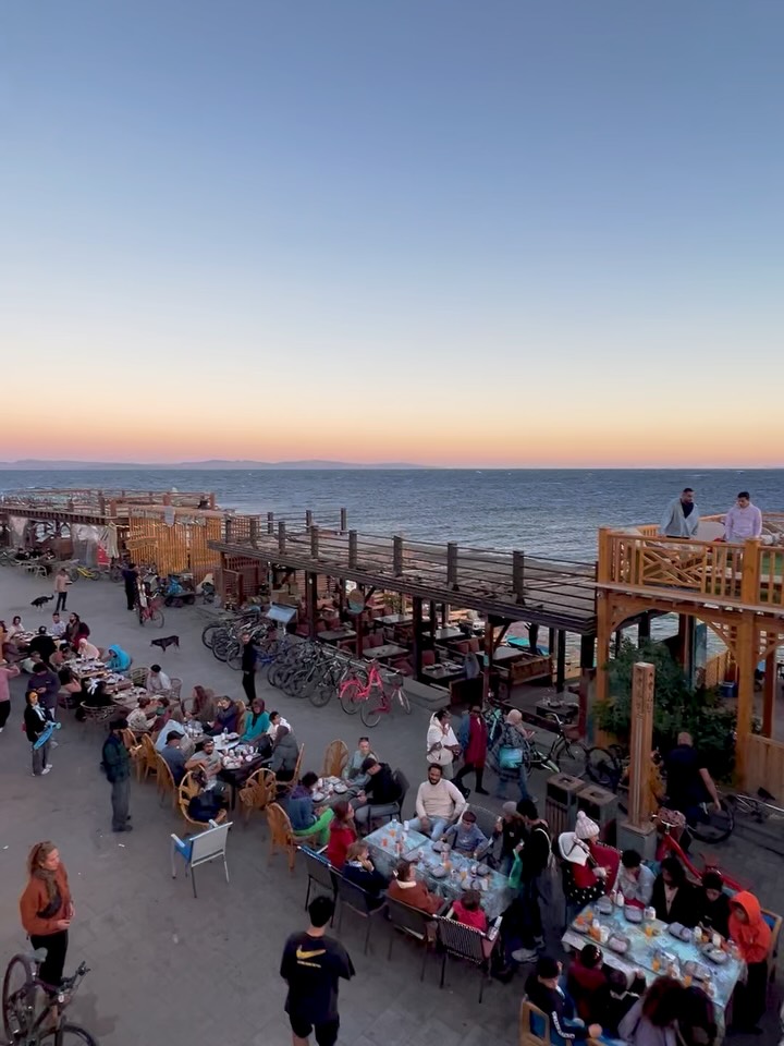 Ramadan ☪️ ~ Every Year on the 10. Day of Ramadan, all the Restaurants of the Dahab promenade (El Mamsha) put their tables out and offer their meals to everyone that shows up.
It’s to share food with those that don’t have much. To share humanity with those that are alone. And to connect with people from all classes and regions of the world.
This is what community looks like!
It is the first year, that I join in and fast along with my muslim friends. It brings me to a whole other level of appreciation for this culture. Going through the hardship of fasting and then eat together at sunset, where everyone brings food and contributes to the meal. This is how spiritual work is supposed to be done. Together in community with discipline and compassion
Ramadan can in some ways be compared to Christmas. They are both highlights of the religous year, full of traditions and rituals. But in Egypt the community is at the core of traditions. They do this not only in Dahab but all over Egypt, where whole neighborhoods take their tables to the streets and share their meals.
#ramadan #community #dahab #spiritualpractice #thisisegypt