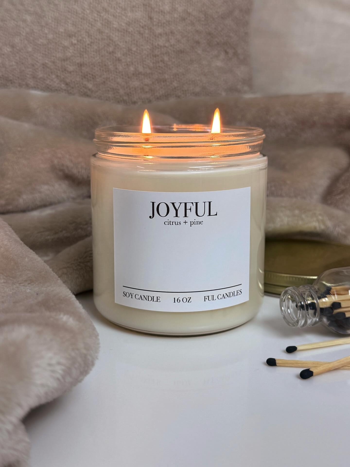Joyful (citrus + pine) continues to be our best selling fragrance. It’s the perfect blend of sugared oranges, lemons, and limes with juicy tropical fruits. Light notes of mountain greens round out this fresh scent. It’s a dupe of the Anthropologie Volcano candle, but made with 100% soy wax.