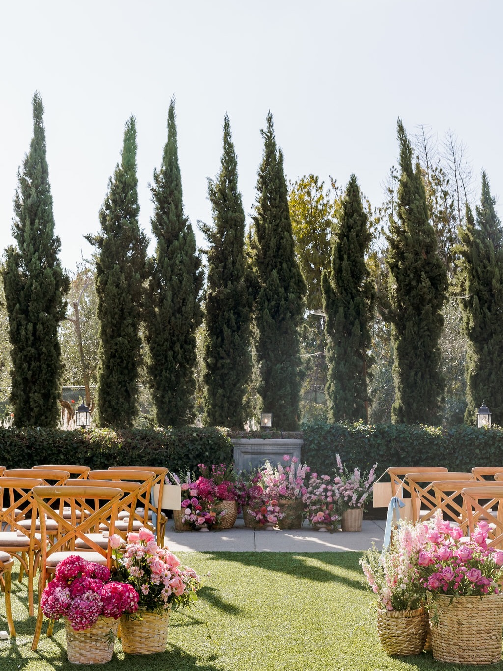Lisa dreamed of a wedding that felt colorful, yet elegant.
So we layered different shades of pink, woven textures, and soft movement beneath the cypress trees creating a moment suspended in light and color for her and Al.
Florals @alinebicharaevents
Planning and photo @willmusweddings
Venue @estancialajolla