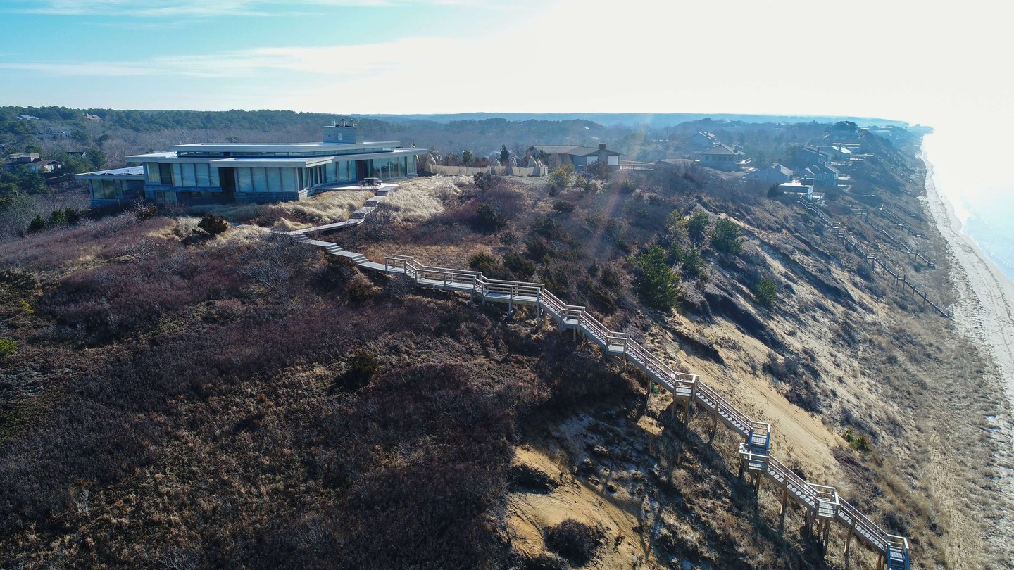 Elevated coastal access, thoughtfully built for the Cape.
The ThruFlow composite panels used for the walking surface will outlast any natural wood material. It allows more natural light and air flow which supports growth of vegetation below and adjacent - vegetation that helps keep the dune intact and helps reduce erosion.
Custom crafted by our team, this beach stairway follows the natural dune contours—offering safe, seamless access to the shoreline while respecting the landscape that makes our coastline so special.
Designed for durability in harsh coastal conditions and built with local regulations in mind, it’s an investment in both your home and the long-term integrity of your beachfront.
#CapeAssociates #BuiltByCapeAssociates #CapeCodBuilders #ChathamMA #OrleansMA #WellfleetMA #CapeCodWaterfront #BeachHouseCapeCod #CoastalHomeDesign #CapeCodLuxuryHomes #CustomBeachStairs #DuneSmartDesign #WaterfrontRenovation #CapeCodConstruction #LuxuryOnTheCape