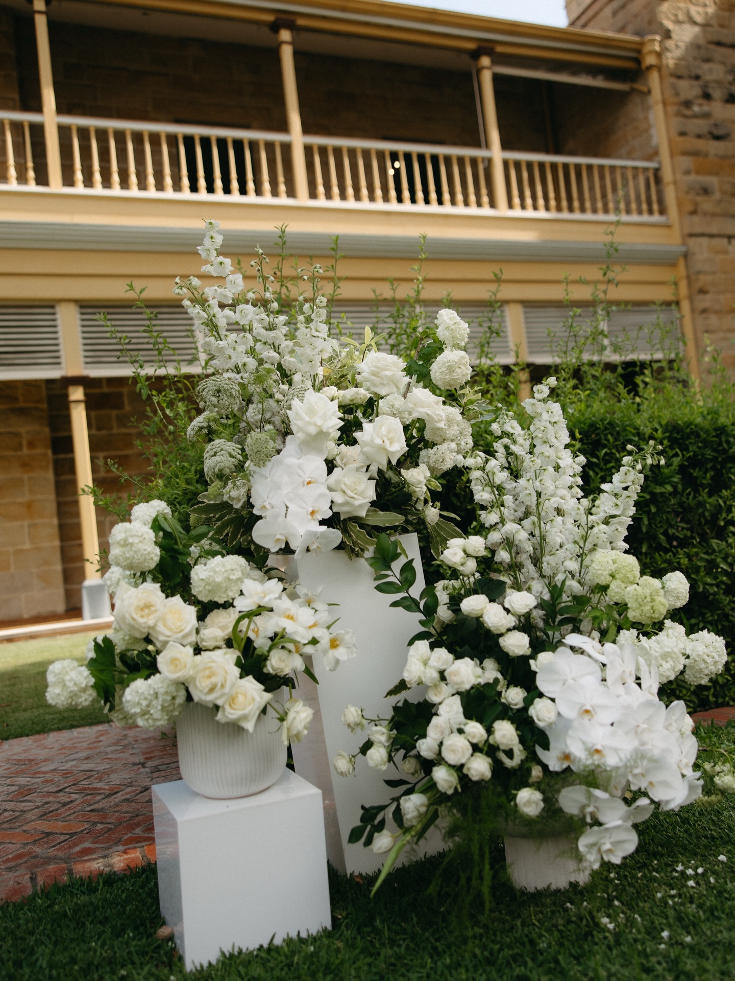 A ceremony setting designed for the garden at the stunning @jimbourhouse before the weather decided to add its own touch.
Classic white florals framed the aisle, layered with roses, orchids, delphinium and soft textured blooms to create a timeless ceremony moment within the grounds.
Just as vows began, the rain arrived and with a quick pivot the celebration moved beneath the veranda, where the most beautiful light carried the moment forward.
One of our favourite reminders that thoughtful design isn’t only about how something looks, but how it adapts when the day takes its own turn.
@mitchbirchallstudios
@jimbourhouse