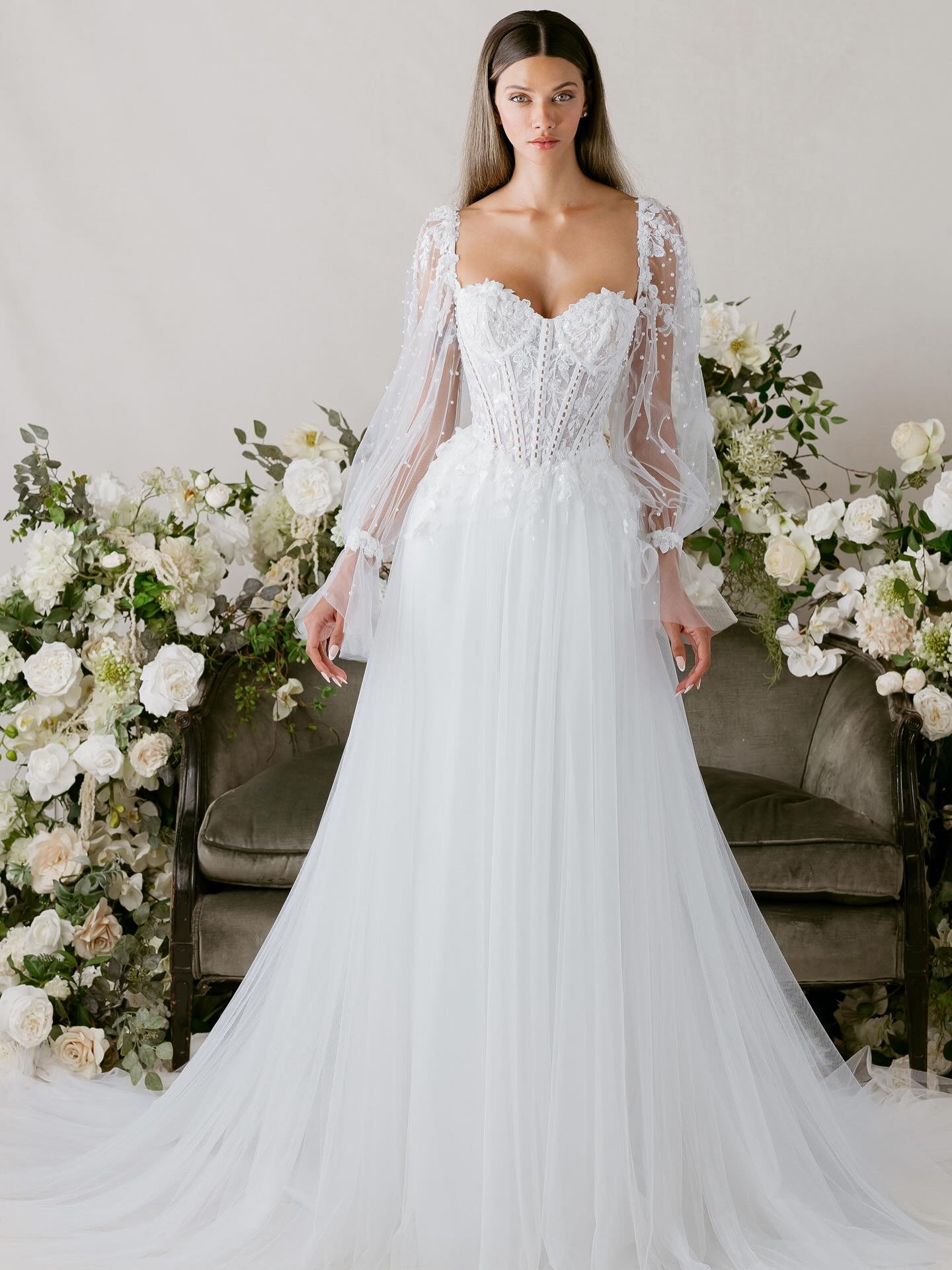 Detachable long sleeves & a detachable skirt add a complete WOW factor to this new @morileeofficial gown! A vision of graceful movement, our Clara wedding dress is a fit and flare gown that feels as light as a dancer’s step. Delicate boning, accented by pearls, and a sculpted basque waist create a refined silhouette, while beaded floral appliqués scatter across the skirt like petals in flight. 🤍🕊️