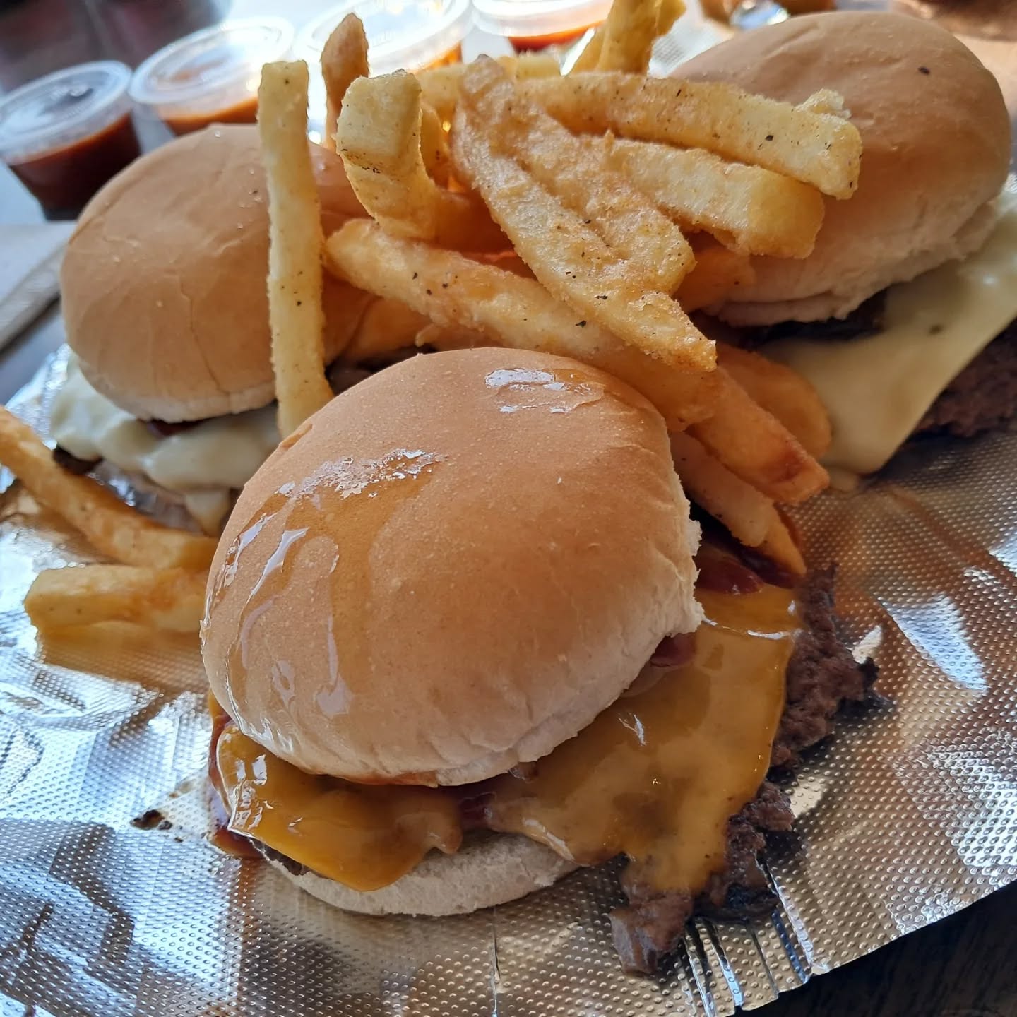 Happy Faturday! Recently Sam and I visited @burgersbehindbars and took on The Flight to Avoid Hunger. This is a 3 burger slider flight from the Marlboro Man and its candy to the spicy Ghost Rider.
We were presented with a litany of sauces and then tagged on a chicken and onion ring chaser.
Good stuff all located within the Grover Inn at 42nd and Grover in Omaha.
Give them a try, let us know what you think and remember to Connect With Food!!