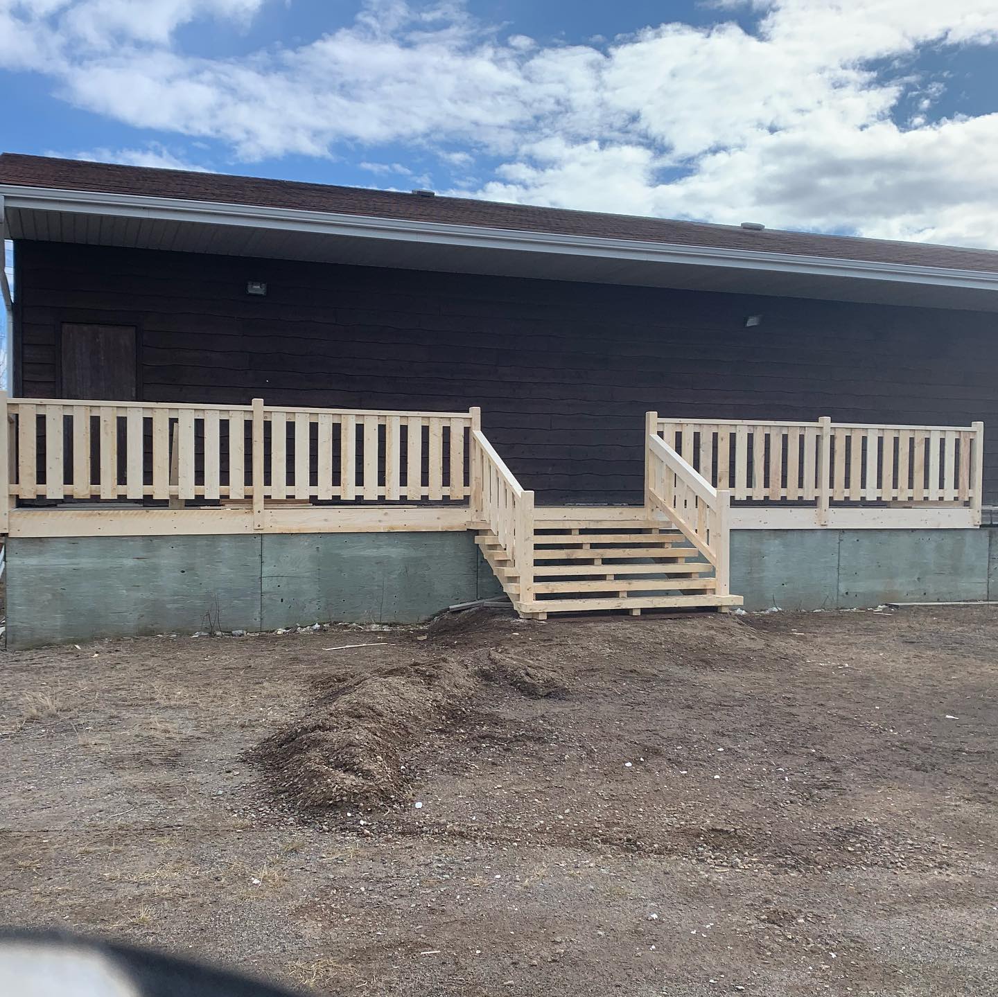 This soon to be store front got a nice set of stairs and railing. The lumber is locally sourced rough sawn pine, giving this entrance a rustic country home look. #roughsawnlumber#localbusiness#soontobestorefront#allstartswithcurbappeal