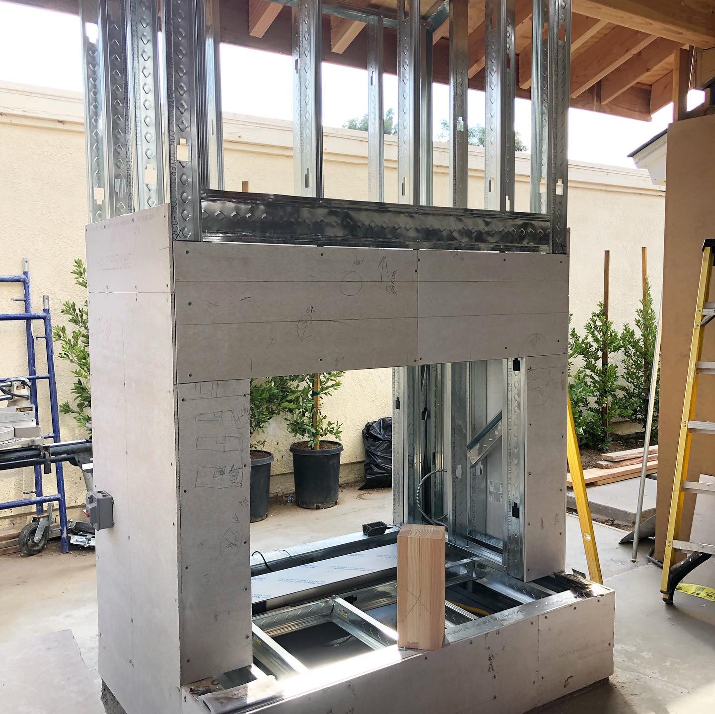 We can’t wait for this cozy California room fireplace to get cobbled! #oclandscape #ocremodel #outdoordesign #outdoorfireplace #outdoorroom