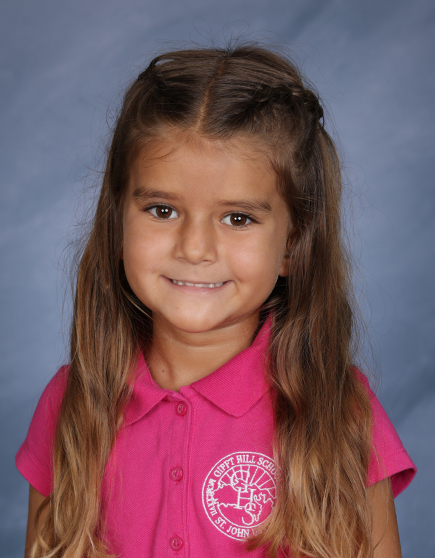 Student spotlight! Kindergartener Calliope Woods has been part of the GHS community since she joined the toddler program in 2022. Kindergarten teacher Ms. G. says Calliope is compassionate and thoughtful.
“She often notices when a classmate needs help and offers quiet support,” says Ms. G. “She’s a truly understanding and empathetic student.”
Calliope says she likes Ms. G. because she’s nice and good at teaching. Calliope especially enjoys learning math, and she’s currently very into reading. Dr. Seuss is her favorite author. She likes her classmates because they’re good at sharing toys, and Spanish is her favorite special “because it’s fun,” says Calliope.
“Calliope is a model student who consistently listens carefully, follows directions, and gently encourages her classmates to do the same,” says Ms. G. “She works independently and demonstrates strong skills, especially in reading.”
Ms. G. says Calliope is a shining example of kindness and responsibility in the kindergarten classroom. Calliope’s confidence has grown this year and she’s adapted well to having her own desk and managing her school supplies and materials.
“She’s incredibly observant and aware of what’s happening around her,” says Ms. G.
In her free time, Calliope says she likes to go to the beach with friends and family, and play blocks with her mom and dad.