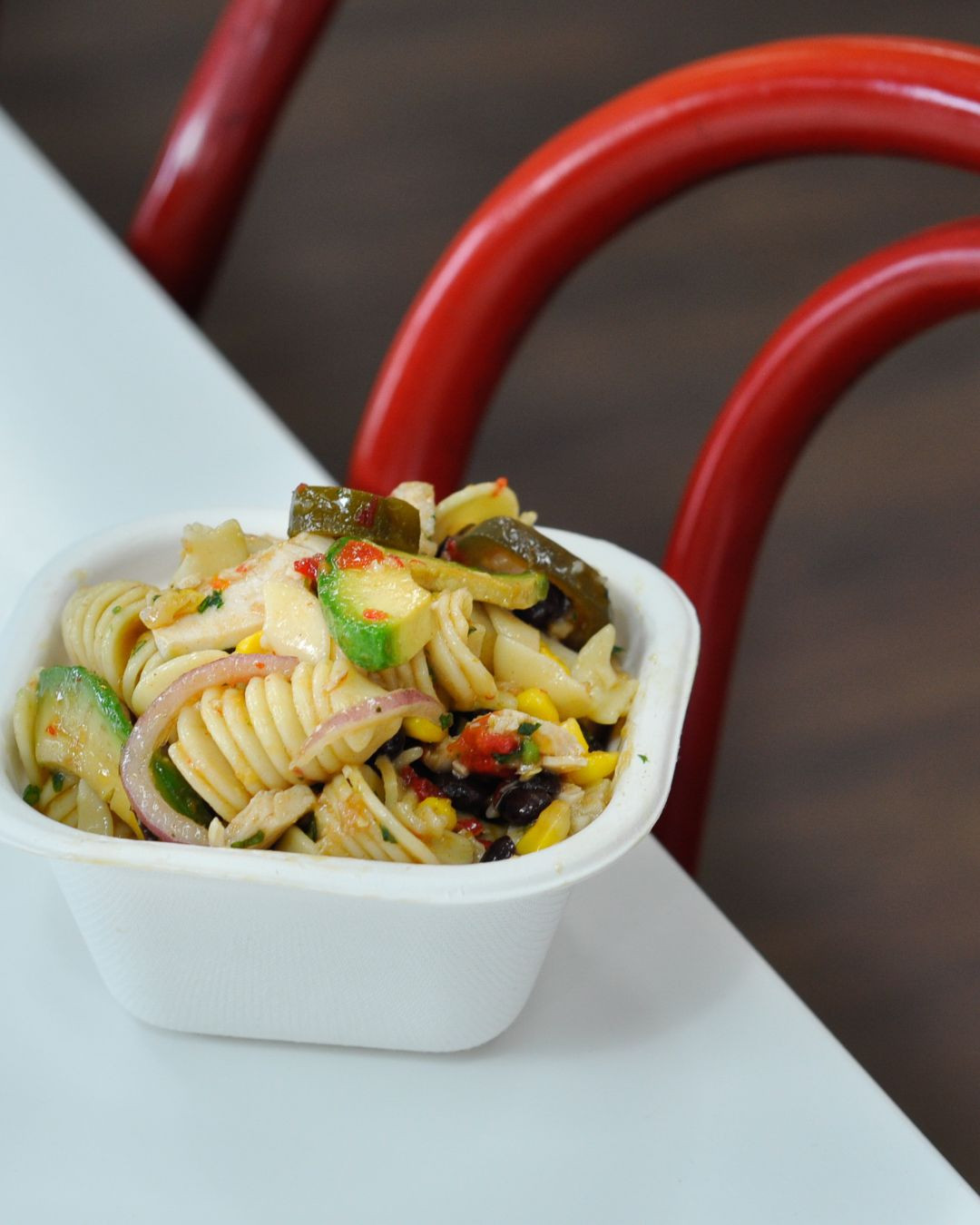 Our Southwestern Chicken Pasta Salad is one of five pasta salads on our menu and is loaded with avocado, chicken, red peppers, cherry tomatoes, red onion, corn, jalapenos, beans, heaps of herbs and a chipotle chilli and lime dressing.