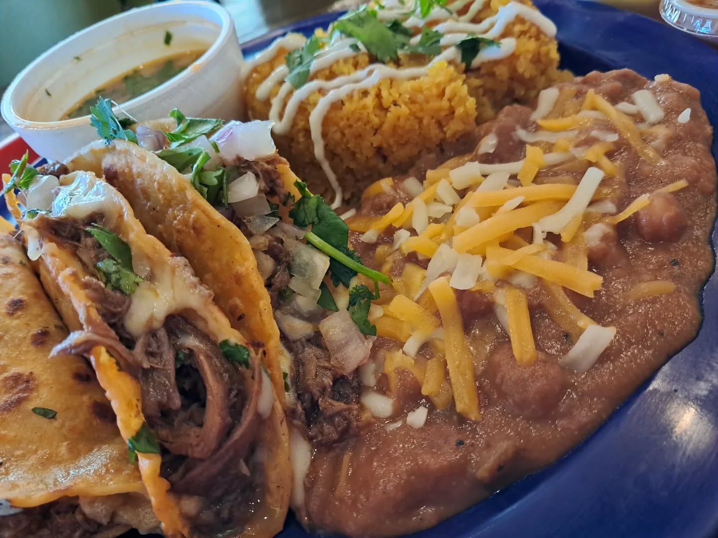 It's a time change Monday, what's a person to do? I think solving that with tacos 🌮 could be the move. @birriaboss_lnk was the spot and a 3 taco plate was the delivery.
Savory birria with consomme for dipping, the beans had a hit of acid that made them a good and unique bite and the rice was dressed with creama and was a very short grain, almost cous cous like and that too was enjoyable.
It's fun and funky inside with your choice of food couch or table. There are a ton of options including a birria grilled cheese sandwich and ramen that I have yet to try. Thanks Birria Boss!