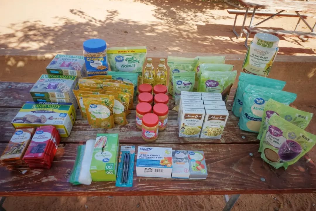 How do you fit 21 days worth of food into a 40 L backpack (plus 16 L front pack)? Hopefully something like this.
I'll be attempting to complete the 800 mile Arizona Trail in one continuous unaided push, beginning in a couple days. Aiming for 21 days for a new Unsupported Fastest Known Time (it's only been completed like this once before).
Food nerd stats:
~120,000 total calories
~5,700 calories per day
158 cal/oz average
47 lbs food weight
My quilt, sleeping pad, tarp, and pretty much all my actual backpacking gear are not pictured and will be stored externally for the first few days until the food volume shrinks and they can slowly migrate back inside the pack. The front pack will eventually be stowed as well, ideally around halfway when the terrain becomes more difficult. At least that's the plan...
#fkt #thruhike #arizonatrail