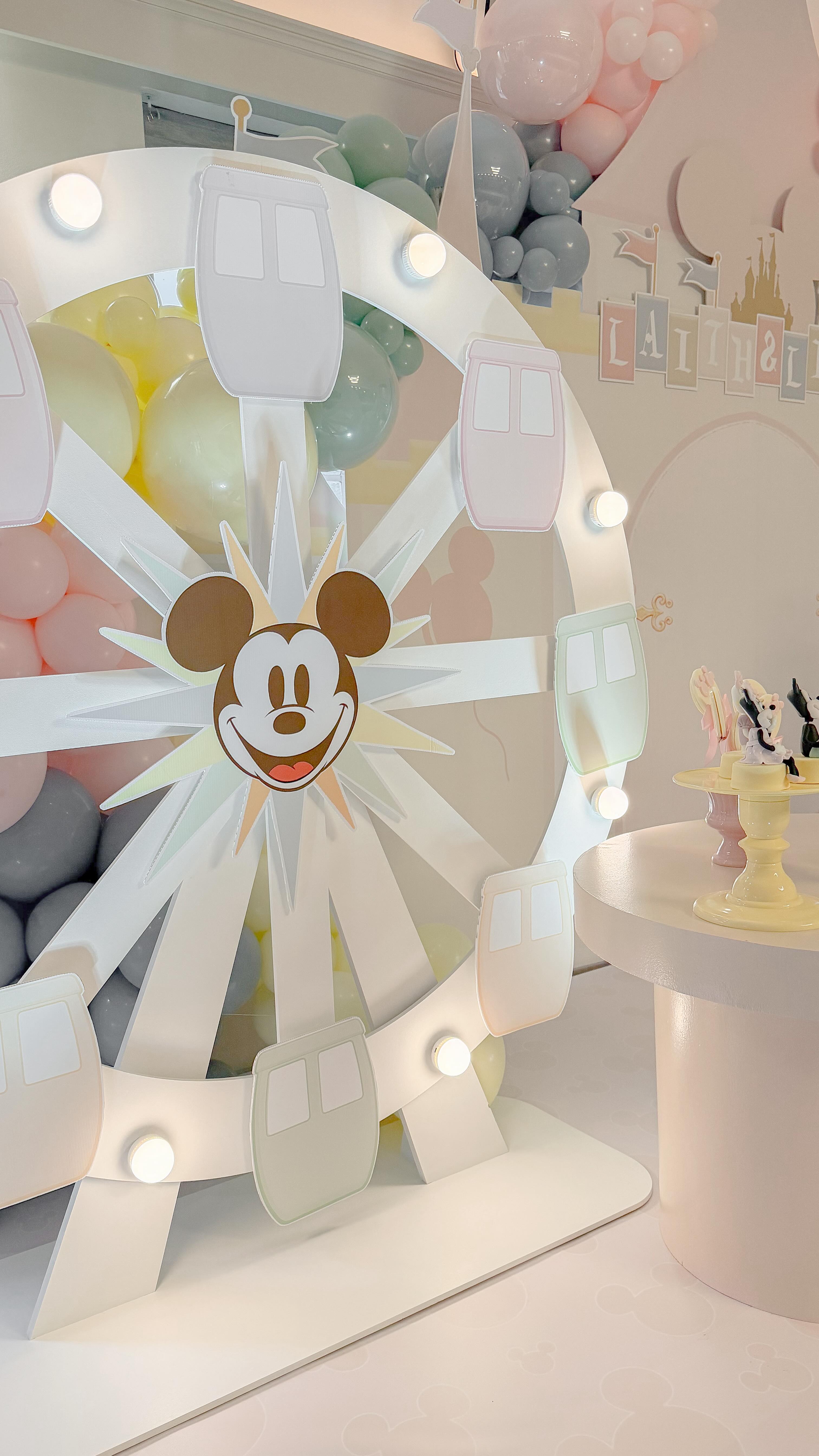 Recently, we did a Disney-themed party with a more vintage twist for twin siblings, Leif and Liana. Since they’re boy and girl twins, the mom wanted a Disney party with very neutral tones. She showed us an invitation she designed herself in beige, nude, butter yellow and an ice blue and asked us to create a décor closely matching the colors of her invite. The result was a neutral Disney wonderland for the two little ones, without losing the Disneyland’s magic with five entertainers, ball pit, bumper cars, a table with activity sheets so they could draw on those Disneyland sheets we loved and the final result was incredible! She was very pleased with the outcome, and so were the twins they had so much fun!