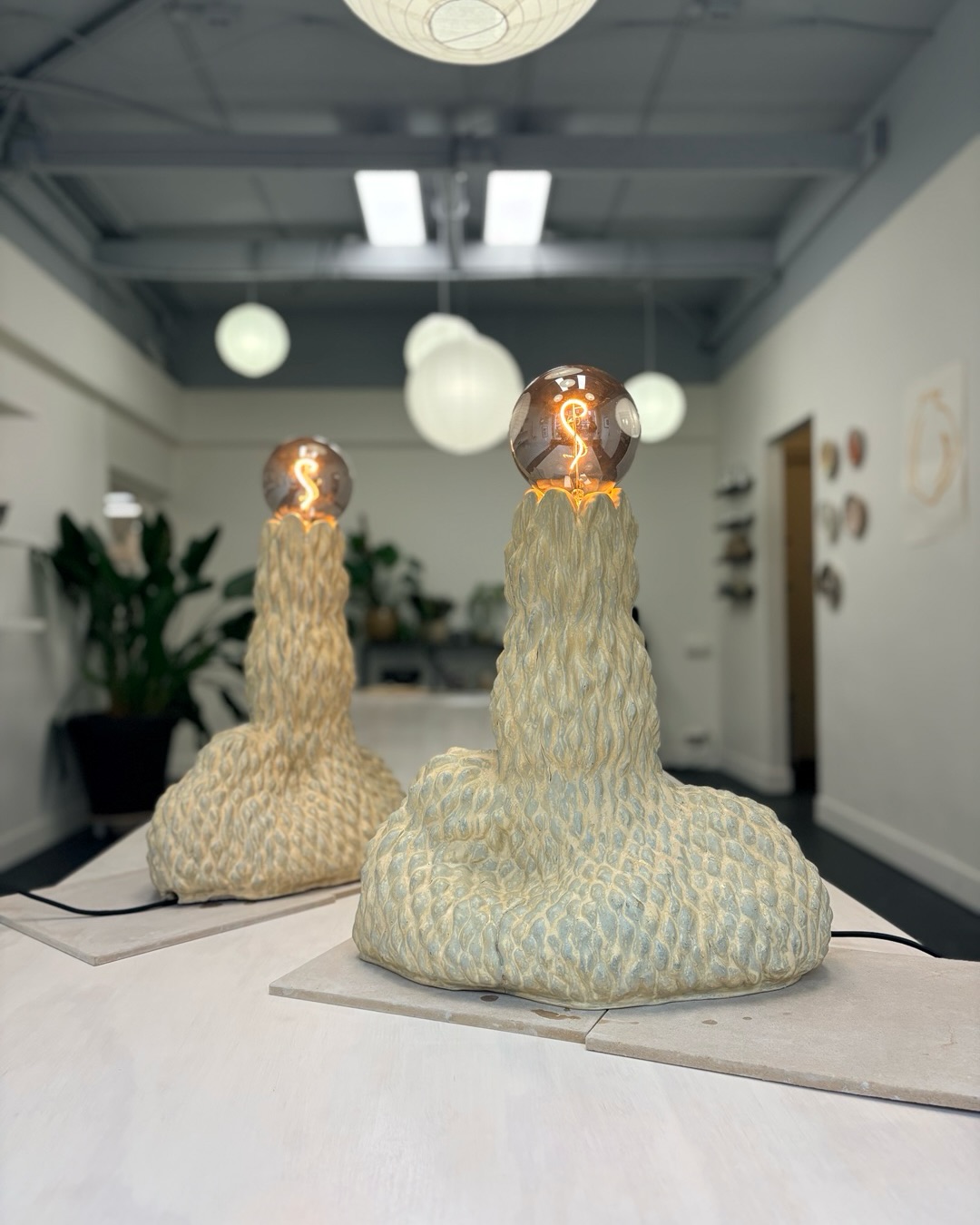 Twin sculptural lamps by our colleague ceramics artist @beddugnne
They were made taking as inspiration the beautiful dunes of The Hague, their shapes, textures and colours, and imagined with the sun rising above. Absolutely gorgeous and a joy to look at them.
Currently on view in our window gallery.