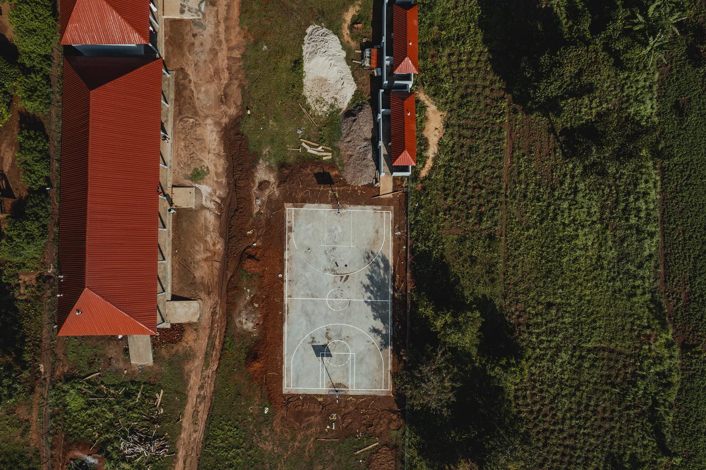 Court is down, hoops are up, lines are drawn. Lots of heavy rains over the past few weeks have delayed the painting process & final touches to our court in Uganda, but we are excited to have an amazing foundation! Stay tuned for more updates! 👀🎨