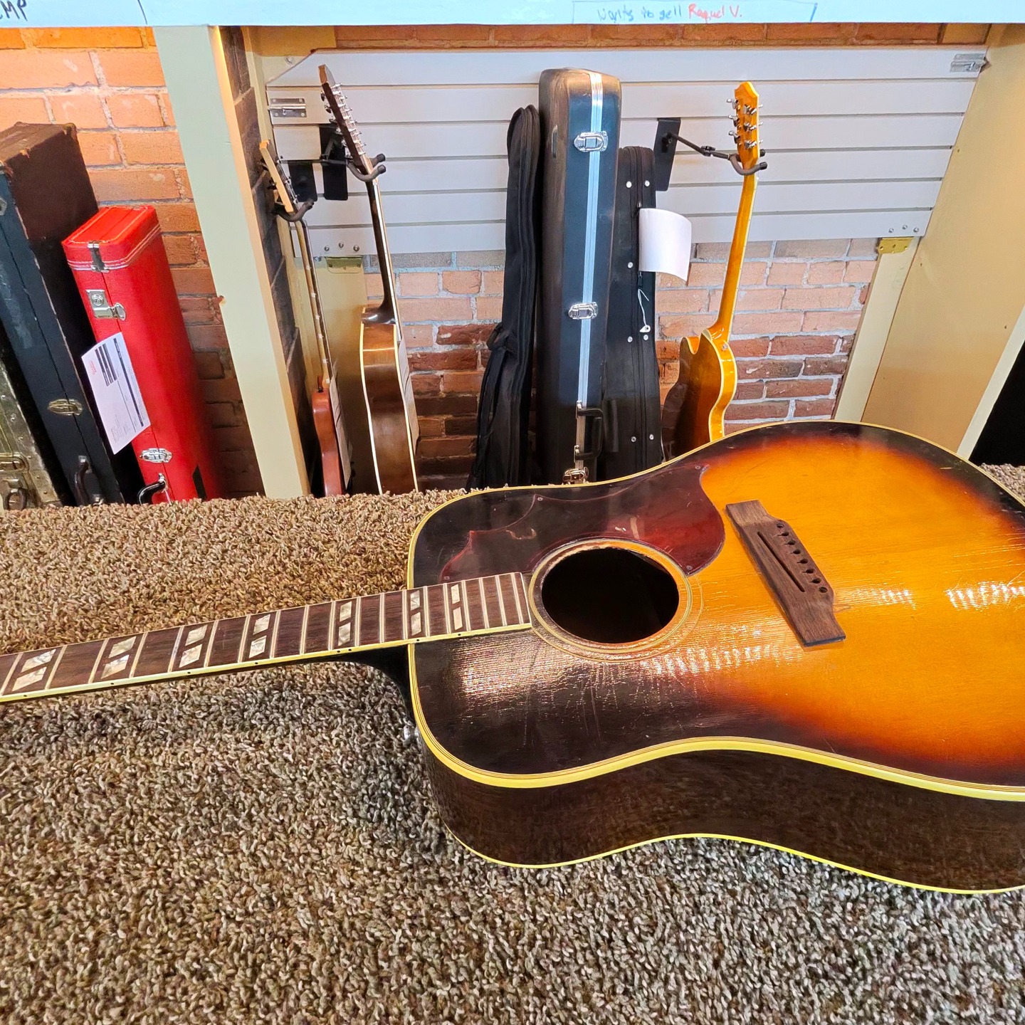 Check out this 1969 Gibson Southern Jumbo we have for sale in our shop.
The 1969 Gibson Southern Jumbo (SJ/SJN) is a highly desirable, transitional-era slope-shoulder dreadnought.
Some questionable modifications were done to this guitar. The bridge has been replaced and sanded down and a very thick bridge plate was also added to the inside.
We are making a new bridge and removing the unnecessary second bridge plate.
There is a unique skinny neck on this 1969 Gibson Southern Jumbo - which allows for faster and more agile playing.
This will be available once the repairs are completed. But, if you are interested now - give us a call or stop in to let us know.