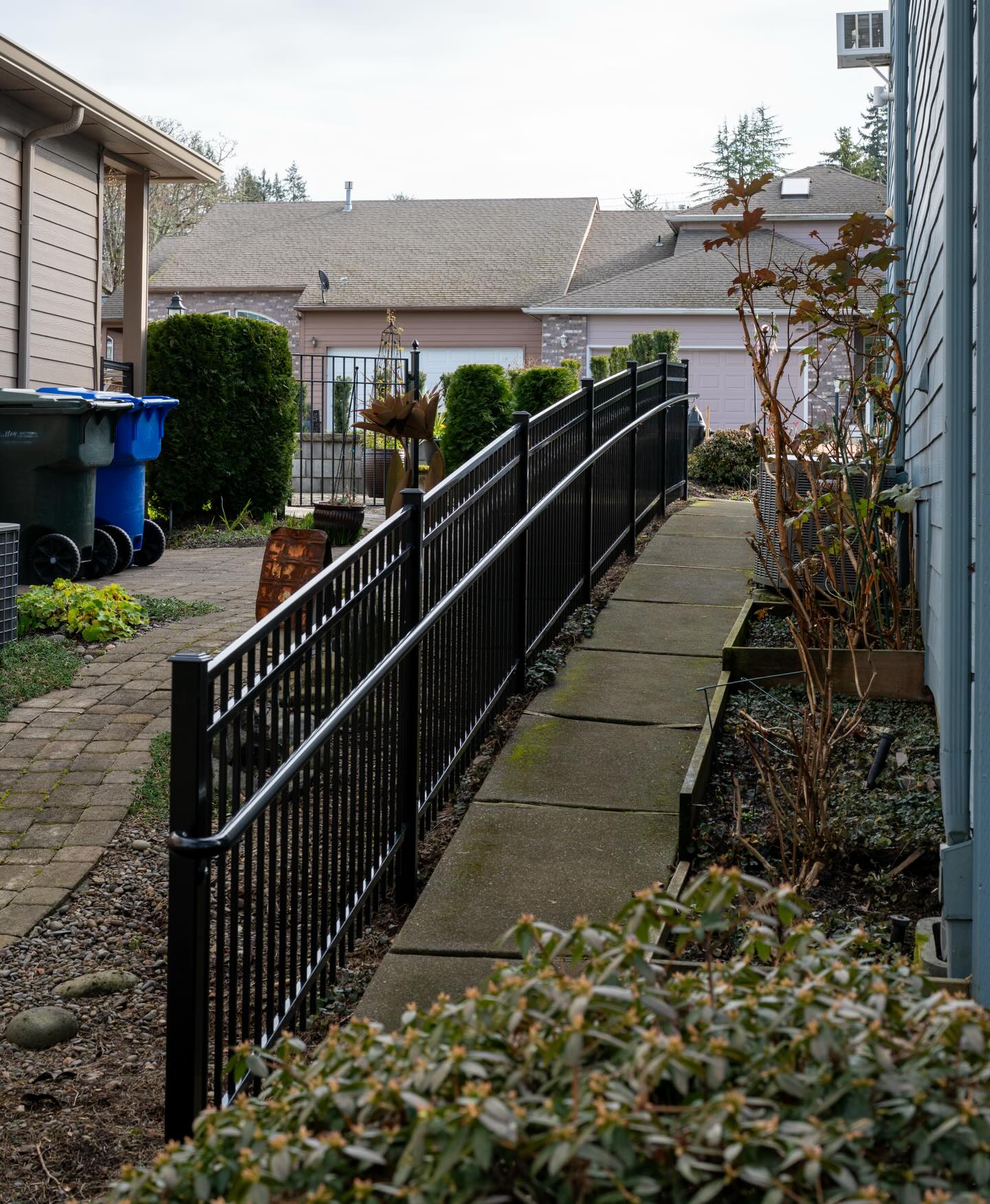 This pathway got an upgrade. Posts with welded caps, rackable fill panels, and a custom grab rail to finish it off.