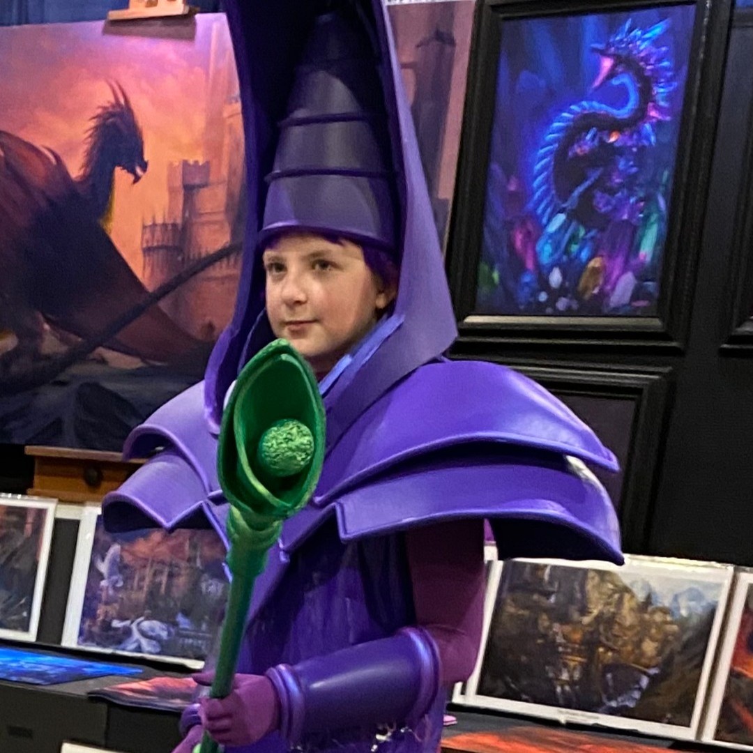 One Dark Magician Costume for my Yu-Gi-Oh fan. I think he liked it!
