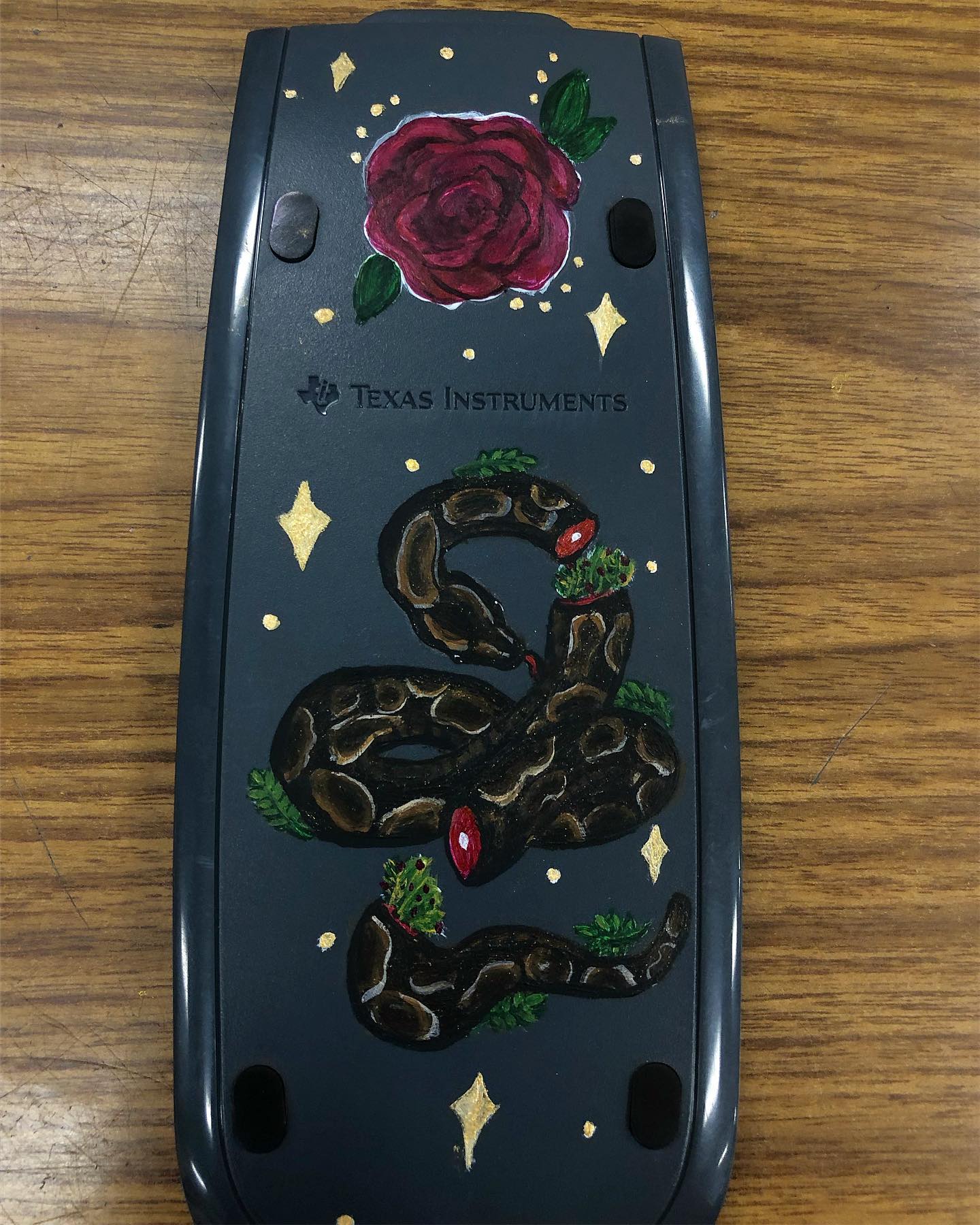 Painted calculator! Ball python on the front, and handsome squid-ward on the back! 💖 commission for Lauren!