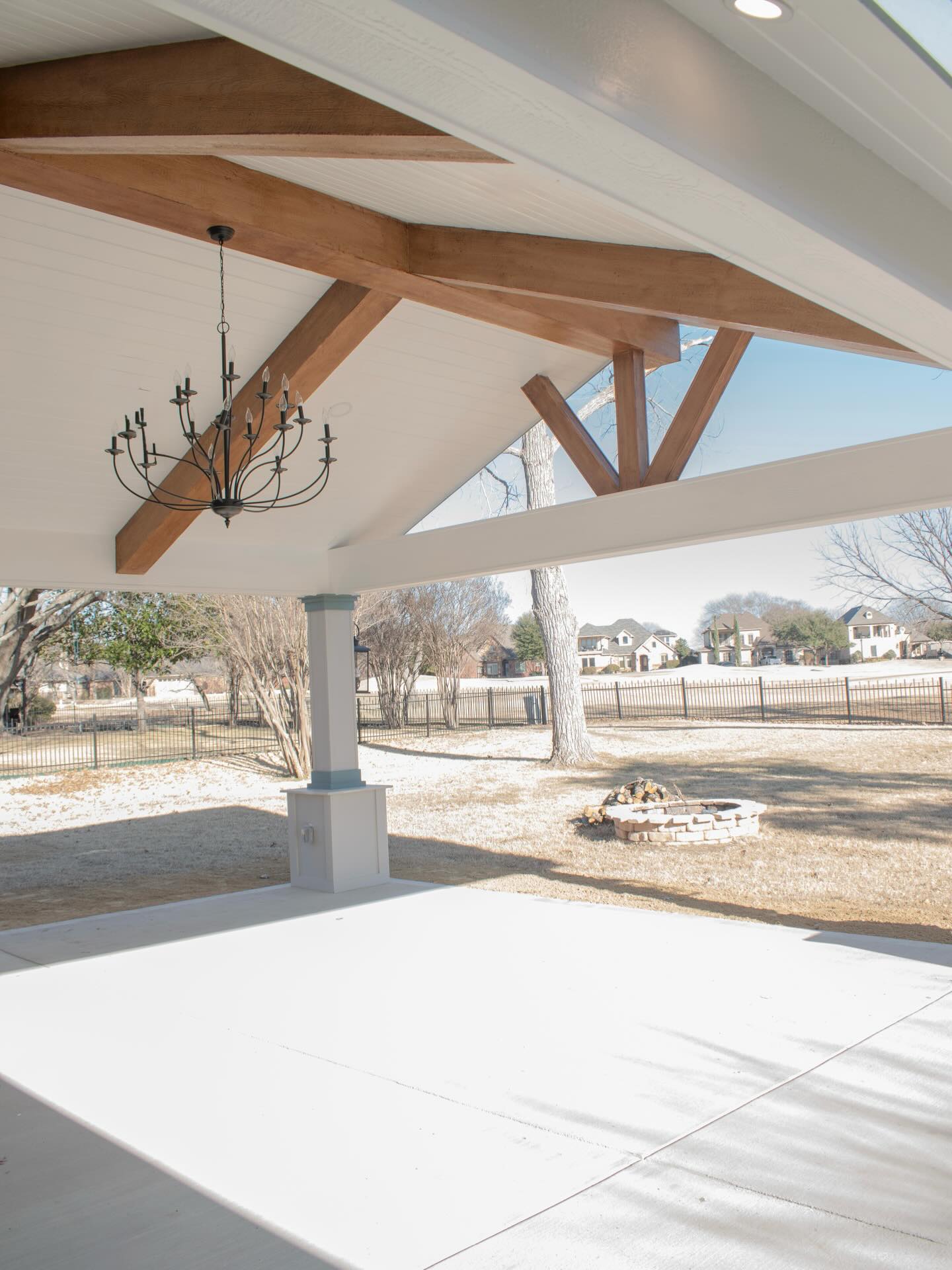 Our latest - A beautifully crafted pergola, seamlessly integrated into the existing roof, overlooking the golf course. The design appears organic, as if it has always been a part of this gorgeous home. This elegant outdoor space is destined to be the site of countless cherished memories. Voila!