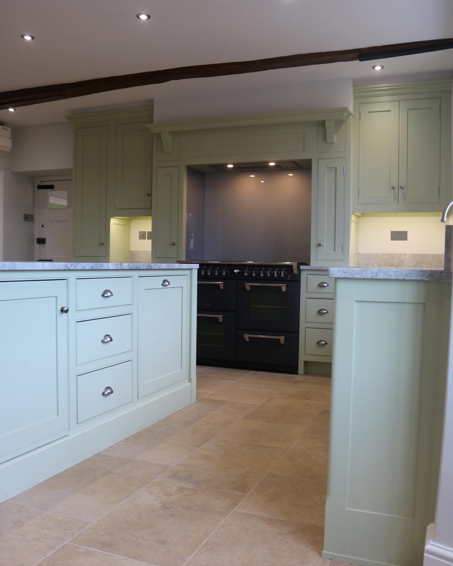 A kitchen that always gets a wow, this place just oozes sophistication and style. We re visited this kitchen to take some pictures of it fully completed! We absolutely love the island in this kitchen, its usefulness of being a place to sit and eat at and also another spot to prep and store! The warm green colour paired with the natural materials make this kitchen a delightfully bright room and what a lovely place to entertain and cook! #jharriskitchens #bespoke #handmade #kitchens #northamptonshire #isleofman