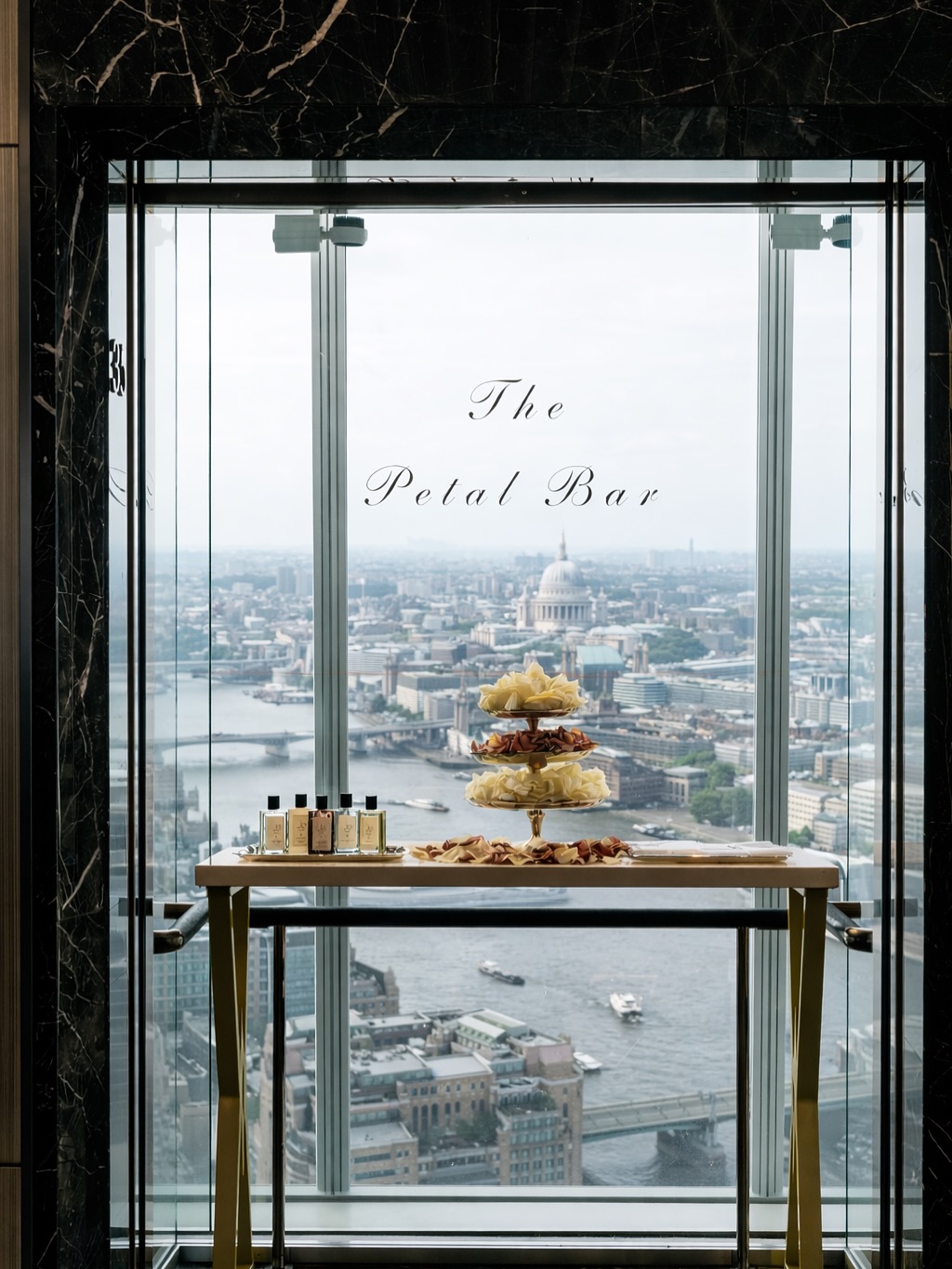 The celebrations begin the second you arrive 🤍
For our wedding at @theshardlondon, we turned the champagne glass lift into a Petal Bar Experience.
Guests selected fresh petals, spritzed them with fragrance from @jolovesofficial creating their own scented confetti to carry with them as the city slowly revealed itself beneath their feet 💛
Venue: @shangrilalondon @kurt.macher
Planning & Design: @daisyamodioevents
Production & Draping: @weareluminaire
Floral Designer: @wildaboutflower
Stationery: @cartaliastudio @theembroiderednapkincompany
Furniture: @optionsgreathire
Bridal attire: @sallybeancouture @victoriapercival_accessories
Bride: @emiilypearl
Grooms attire: @scabal
Entertainment: @emporiumlivemusic @aston.band
Celebrant: @jennifer_patrice_celebrant
Beauty: @teamglamofficial
Guest Gifting: @gigiandolive_ @jolovesofficial
Photography: @davidcphotography @rebeccasearlephotography @harrytarbuck @theysaidyesphotos
Videography: @ryanedwardsweddingfilms @servoweddings
Content Creator: @mbweddings_events