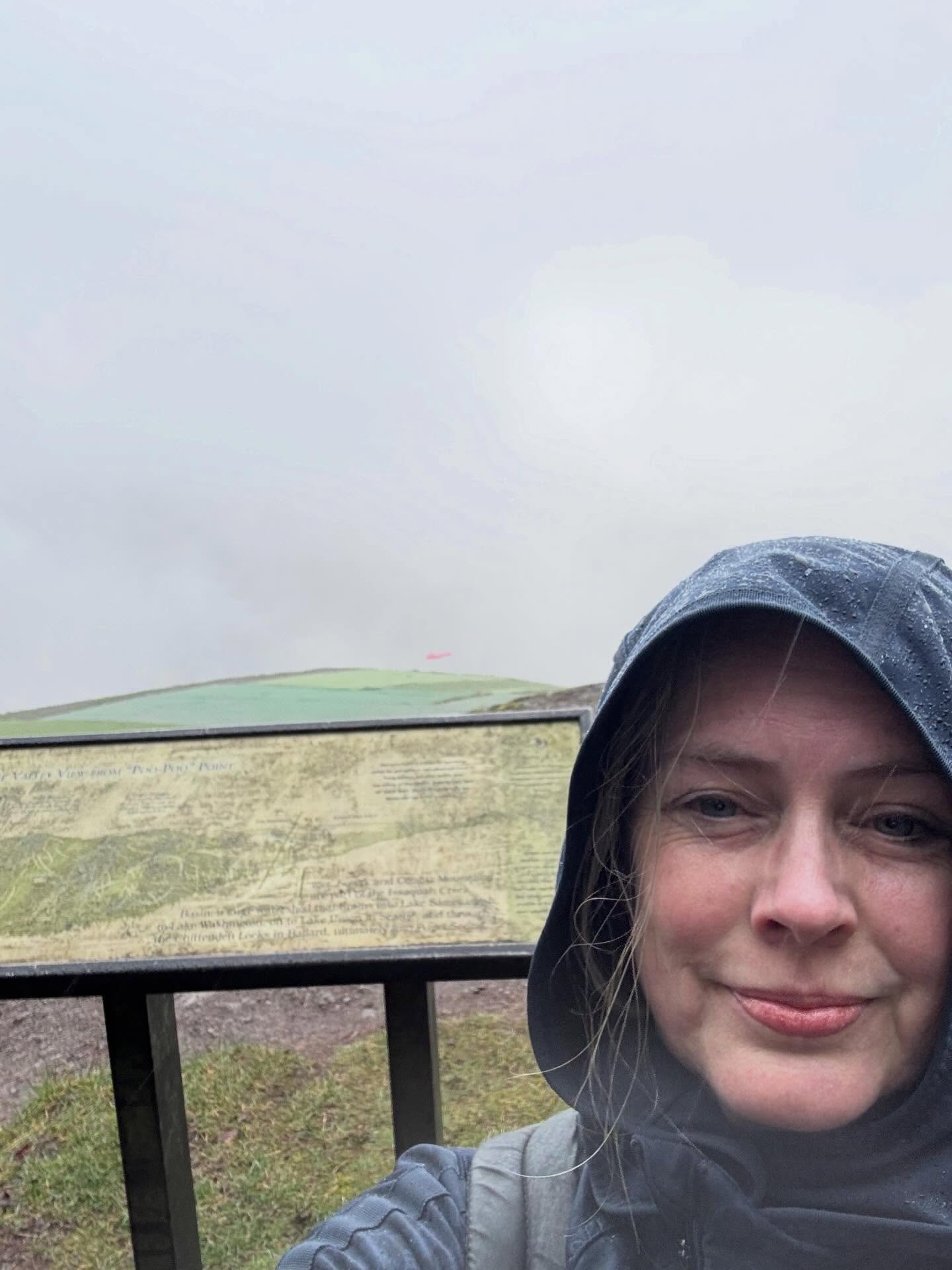 Spring Training at Poo Poo Point
Five things I saw:
šA friend I hadnāt seen in a long time. She was leaving as I entered the trail. She and her friends looked soaked and happyāgiving me a clue about my future.
šRivulets of water crossing the path.
šTwo different dogs. (One Aussie twice on the way up and down)
šAn incredible view of the valley that opened up.
šA slug on a tree. It was that kind of weather.
Four things I heard:
šA variety of English pronunciations from the people as we passed each other. Iāve always thought that hiking attracts a diverse crowd.
šRain. I heard lots of rain. I was sheltered in the trees from most of it.
šWind rustling the needles in the evergreens.
šMy heart beating quite loudly in my own chest no matter how slowly I went. It occurred to me that I could take my pulse without needing to touch my skin. Apparently 1500+ feet in two miles is as steep as they say it is.
Three things I felt:
šMy new shoes on my toes. I liked that my consignment store hiking boots were waterproof and warm but the fit wasnāt great. Iāll need to shop around.
šThe cool air on my skin. I always like how exercise helps me feel comfortable outside in most weather. I wasnāt cold at all.
šTired. I felt especially tired at the end.
Two things I smelled:
šMud. I smelled lots of mud.
šChocolate. At first it was the chocolate in my imagination as I dreamed up my reward at the end of that trail. Then it was the real thing in Boehmās, my favorite German chocolate shop in Issaquah.
One thing I tasted:
šAn amazing dark chocolate peanut butter cup. My inner toddler was still a little fussed that I dragged her out in the rain like that but she was pretty happy with that treat at the end.