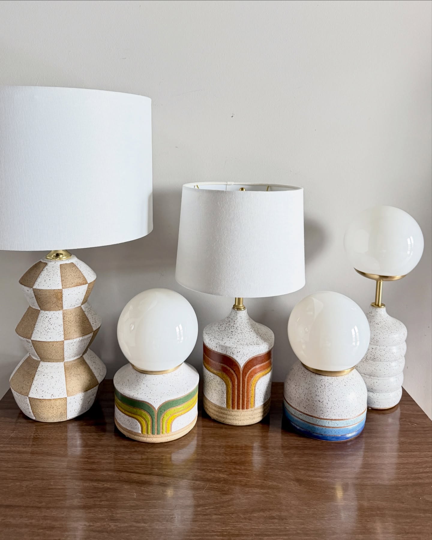 Lil’ family photo sesh with some of the lamps 💡
I throw all the ceramic lamp bases on the pottery wheel, and decorate them with hand taped or custom made stencils. I make my own glazes to achieve a supple satin finish, and assemble the lamps using brads hardware and cloth covered cords.
#ceramic #pottery #ceramiclamp #retro #homedecor