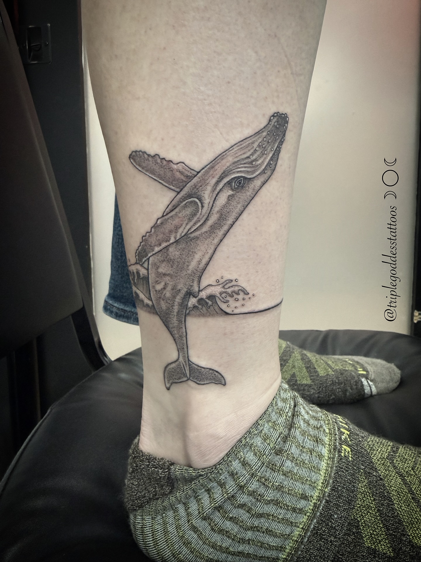 When I was a kid, I thought the Enya song “Orinoco Flow” was singing “save a whale, save a whale…” I have a core memory of jumping up and down on my bed with my best friend singing that very loudly.
-
Created this fun stipple shaded humpback whale and minimal water line as a band that goes all the way around her ankle for the loveliest client. Thank you so very much!
-
#triplegoddesstattoos #whaletattoo #stippletattoo #dotworktattoos #lineworktattoo