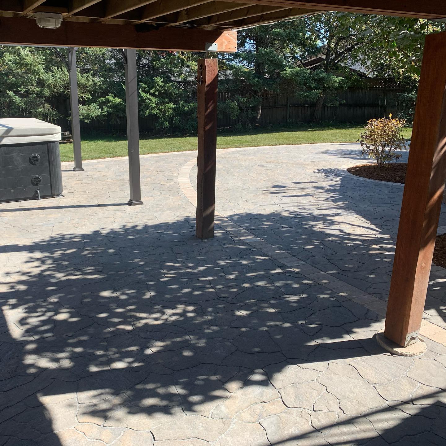 This backyard just got a lot more user friendly! The barkman flagstone patio/Roman paver patio makes the hot tub area a lot cleaner as well as creating a great spot for seating area or above ground campfire. @barkmanconcrete #partytime#interlockpatios#beforeandafter#curbappeal