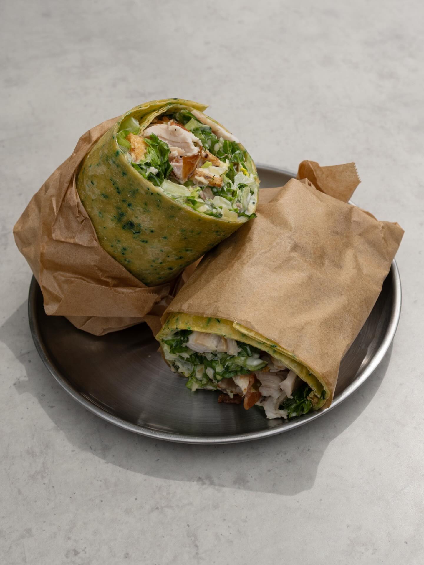 Hitting the shelves tomorrow; Roasted chicken, crispy cos, bacon, croutons, Caesar dressing, Parmesan on spinach wrap.