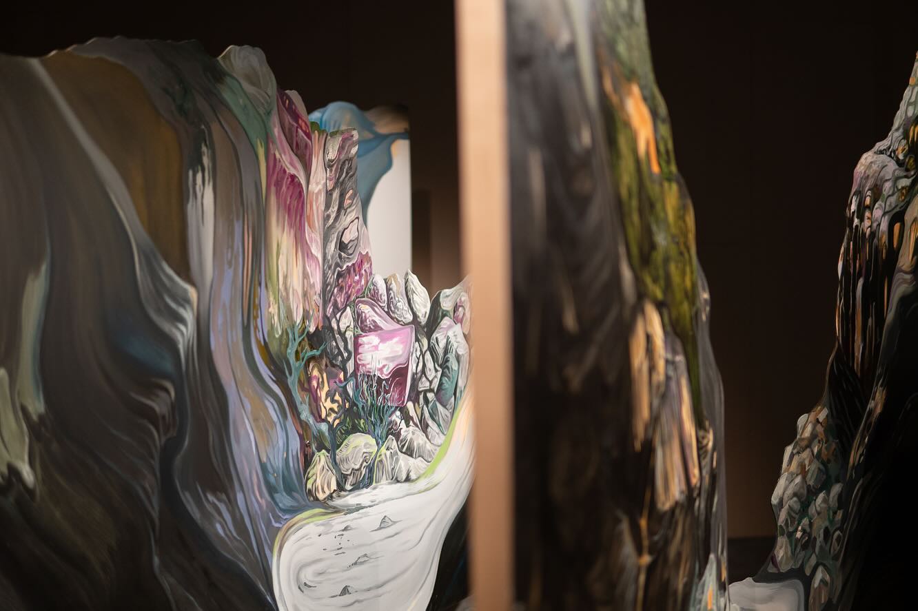 Titanium white is today an important pigment for artists. In the 1920s, Norwegian artists
and designers were commissioned to create advertising campaigns for titanium white. The artists in the second room of the exhibition «Campaign!»however, work with the history of titanium white in a very different way. This exhibition shows
representations of landscape undergoing change from past to present.
The second room of «Campaign!» is called «Gold Frames and Grey Gravel». In the middle of the room is the painting-installation «Storgangen» by Maiken Stene (b. 1983, Sokndal). Stene’s painting is surrounded by other depictions of the local landscape in transformation, created by people in different roles and with different backgrounds. The room displays photographs from Jøssingfjord around 1900 by the engineer Eystein Berg (1878-1957); geological maps made through the use of electromagnetic radiation; old post cards with pictures of roads; a painting of Jøssingfjord by an unknown German soldier; aerial photographs from the discovery of the Tellnes ilmenite-ore; two wooden panels carved in relief by Thrine Brun (1909-2003) who worked at Titania AS; and drawings by Werner Otto Lichtenberg (1903-1987), where white sea spray and forest snow are both painted using toothpaste containing titanium dioxide.
«Gold Frames and Grey Gravel» also question the hierarchies of art history. What is a beautiful landscape? And what is a beautiful picture of a landscape? Which representations of landscape are considered worthy of museum display, and which ones end up outside the history of art? The exhibition displays works by artists both inside and outside the art establishment, some by unnamed or self-taught artists.
All photos by Hanna Biørnstad @hannahavfrue
«Campaign!» will be on display at Jøssingfjord Science Museum until 1 December 2024.
@maikenstene @jossingfjordvitenmuseum @rom_for_kunst_og_arkitektur