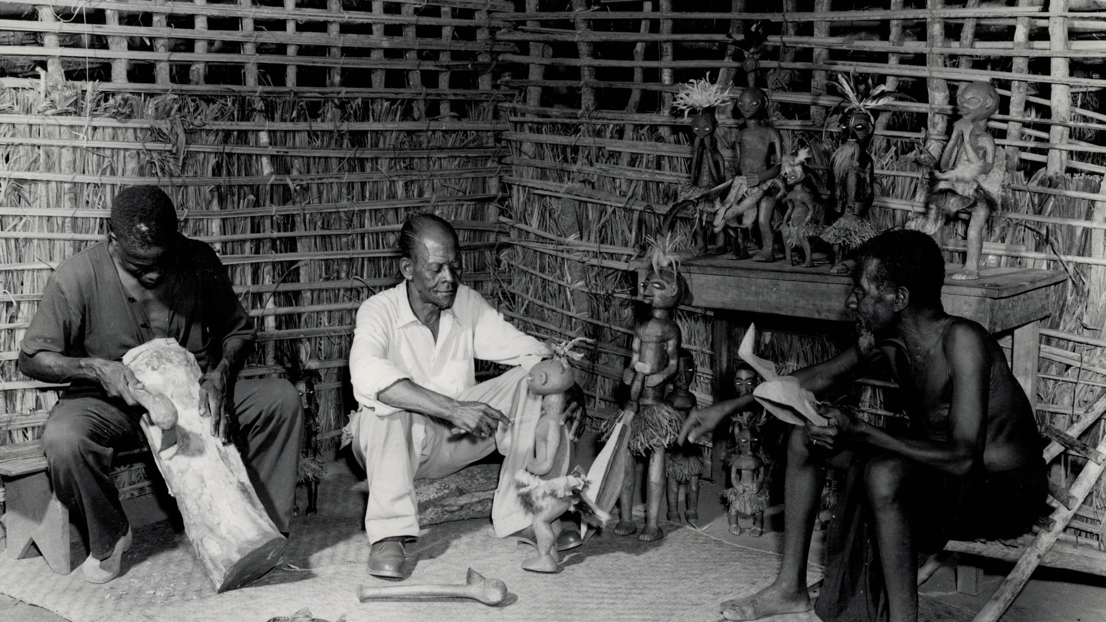 Lieven Storme vintage African photography and tribal art.
Picture of the day #132
Heart4Darkness offers a collection of over 5,000 original vintage photographs that illuminate the rich cultural history and heritage of the African continent. All photographs have been assessed for authenticity, artistic quality, and condition of preservation and are unmounted or disbound unless explicitly stated otherwise.
Photographer: Lamote, Carlo (1928 â 2017).
Title: untitled (Atelier Milambo - KasaĂŻ).
Date: ca. 1955.
Country: Democratic Republic of the Congo.
Medium: unmounted gelatin silver print.
Size: 18,1 x 23,9 cm.
Condition: very good.
Reference: CLVI0313/1.
Provenance: Coll. André Vanhecke, The African Connection, Varsenare (B).
Extra: typed note with identification in French and Dutch and stamp on verso. Congopresse 31.226/40.
The Belgian painter Robert Verly founded âsocial workshops for indigenous artâ in the Tshikapa region of KasaĂŻ, where Congolese sculptorsâprotected from foreign influencesâwere able to continue the development of their own artistic traditions. In the image we see the old master Kaluesha (on the right), the sculptor Musenga Bongo (in the middle), and the apprentice Kabongo Mai Mai at work in their studio. They mainly produced fetishes in a typical primitive style, related to the art of the Bena Lulua.
Location: Milambo (Bena Kondji or Bakwa Tshibasu-clan).
Territory: Tshikapa.
Province: KasaĂŻ.
Photographer and cameraman Carlo Lamote (1928-2017)) left for Congo in 1950 to work for the colonial information service. For ten years, he travelled to every corner of the Congo, Rwanda and Burundi to highlight the colonial achievements. Propaganda is the name of the game, but he turned out to be an excellent photographer. Together with his colleague Henri Goldstein, Lamote has shaped our image of the Belgian Congo. Open any book about the 1950s in the colony and you will find their names under the photos.
After independence, he set up his own film production company and news agency, with Visnew, ABC and CBS as regular customers. He was also the founder of Congovox, the news service of the Congolese state broadcaster.
#drcongo #carlolamote