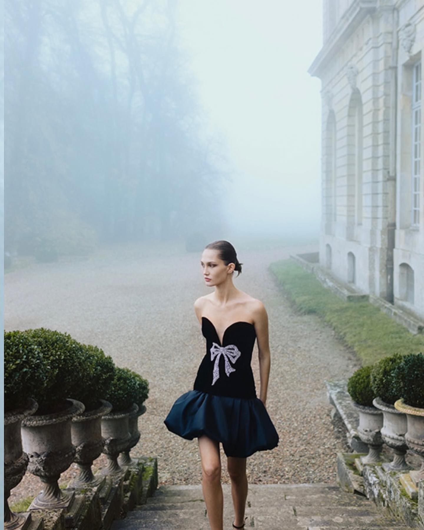 Monique Lhuillier RTW Fall 2023. A hauntingly beautiful misty day at Champlâtreux. @moniquelhuillier