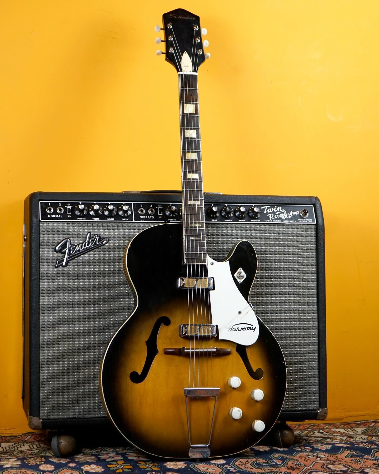 1962 Harmony/Silvertone Rocket.
The eagle-eyed among you may notice something strange about this picture.
I had a fully-loaded ‘62 Harmony Rocket body whose neck was sadly beyond repair. I paired it with a same year (and of course, same factory/templates) Silvertone 1454 bound/block inlayed neck, completing a rather handsome guitar indeed.
Sold, but too cool not to post.