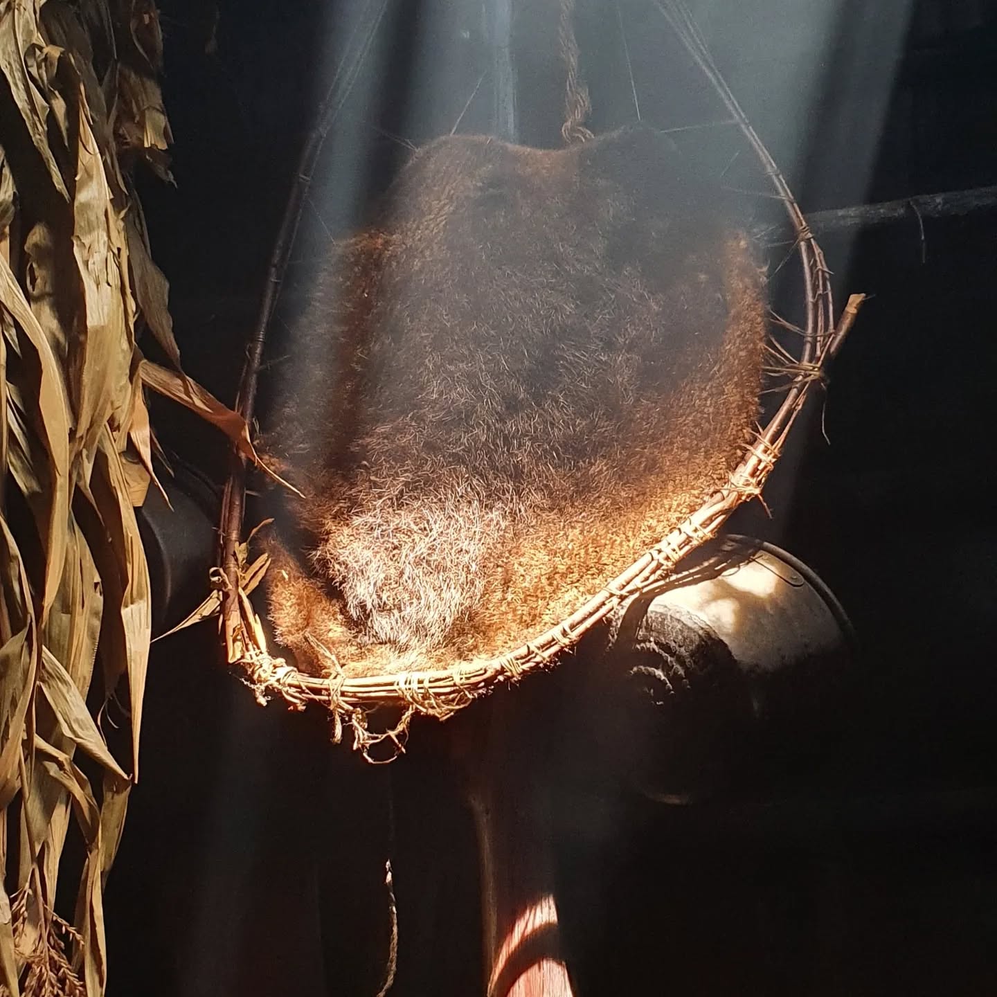 Learning more about the Wendat people in this smoky long-house.