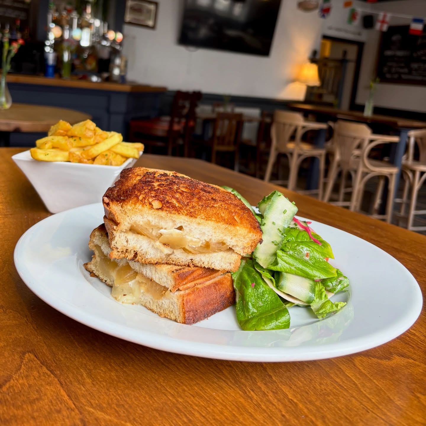 Come and check out our new toastie: Goatโs Cheese & Confit Onion with a house salad only available at lunch time! Try with our garlic butter fries