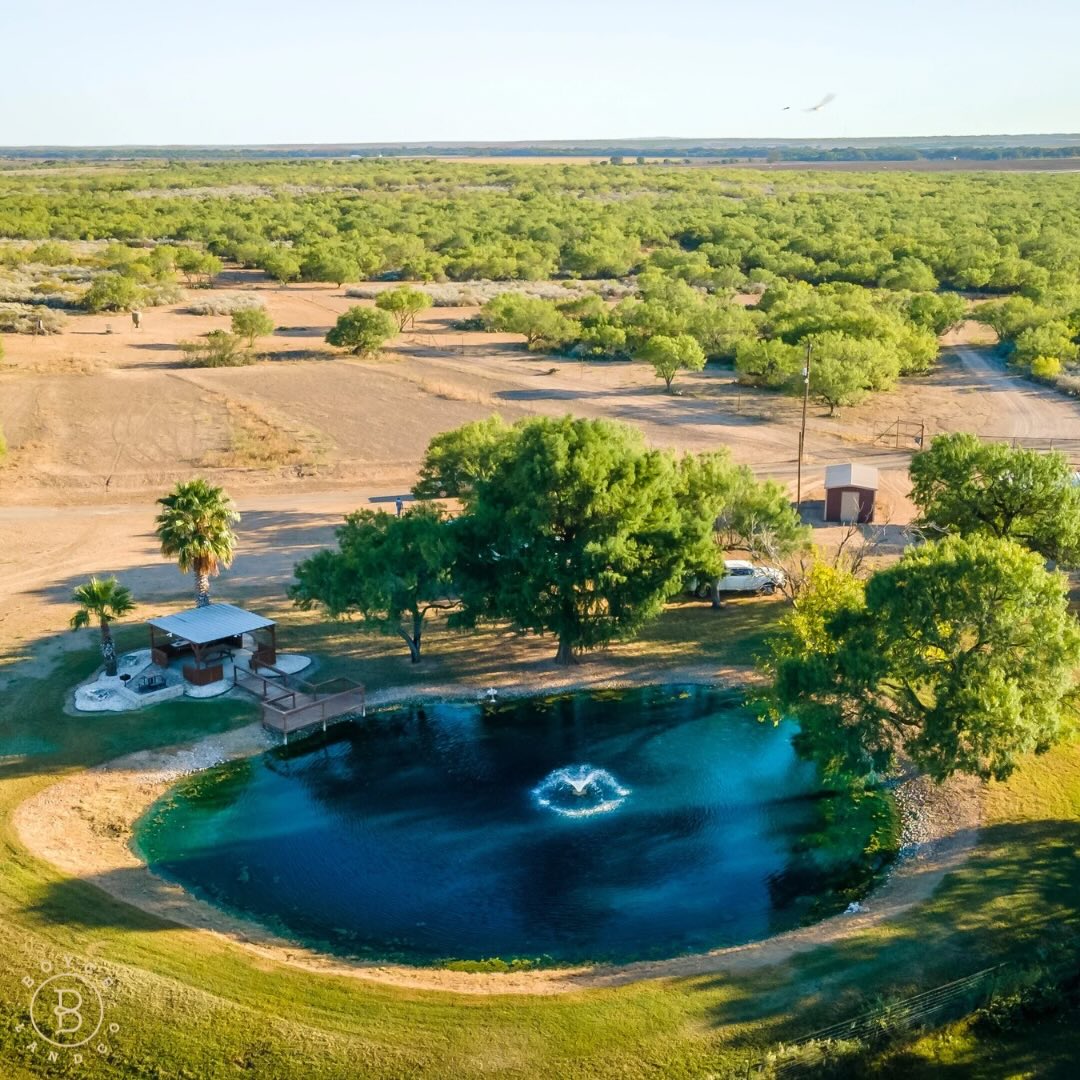 Nunn Ranch | 385 Acres | Uvalde, TX
Just 7 miles southeast of Uvalde on FM 140, this 385 acre ranch sits on one of the highest hills in the area and offers excellent hunting, strong water, and a long list of improvements.
🎣 Ranch Features:
• High-fenced perimeter
• 2 stocked fishing lakes + multiple ponds
• 9 water wells
• 4 irrigation pivots + irrigated food plots
• Native and exotic wildlife
• Skeet range + pistol and rifle range
🚜 Improvements Include:
• 3 bed / 2.5 bath custom lodge-style home
• Guest house
• Infinity pool + hot tub
• Multiple barns and shops
• Game cleaning barn with walk-in cooler
• Outdoor bar and custom fire pit
A well-rounded Texas ranch with excellent water, wildlife, and improvements already in place!
For more information, contact Sterlin Boyce (830) 426 8175 | sterlin@boycelandco.com