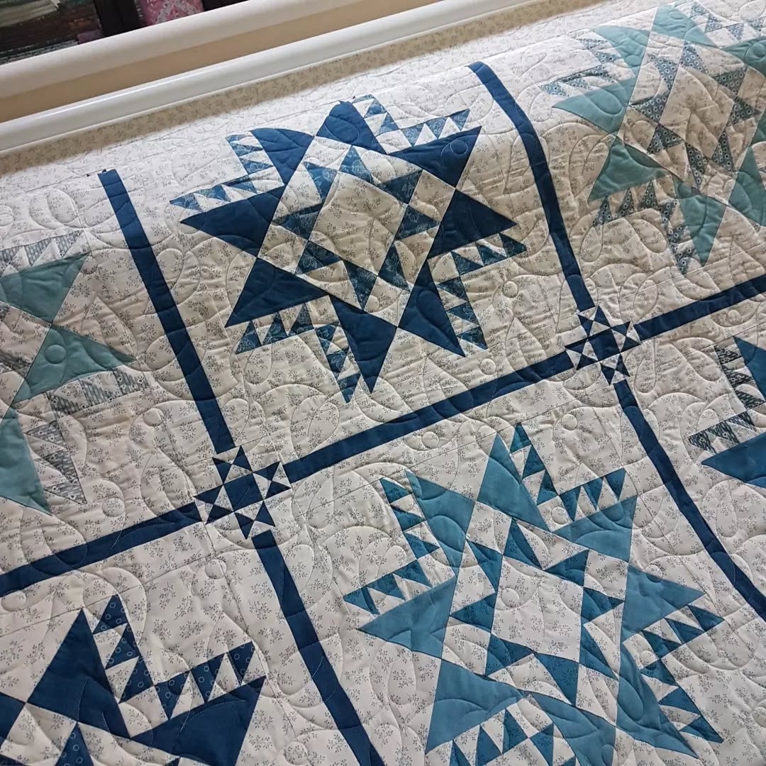 It's been a busy week ...and it's only Wednesday!!! I've had both my longarms up and running the last few days.
The first quilt is a beautiful queen size star quilt made by my client Joanie. I used the "creeping fig" edge to edge pantograph and a dove grey thread. It's being sent home to North Vancouver tomorrow.
The second quilt is a super soft flannel that's been custom quilted and has a wool batting for added texture. Someone's really going to enjoy cuddling with this quilt ❤
#quiltingismypassion #mistymountainstudio #longarmquilter #quiltersinvictoriabc #quiltersofinstagram #canadianquilter #apqsmillie30 #quiltpath #quiltersgottaquilt #urban.elementz #longarmquilter