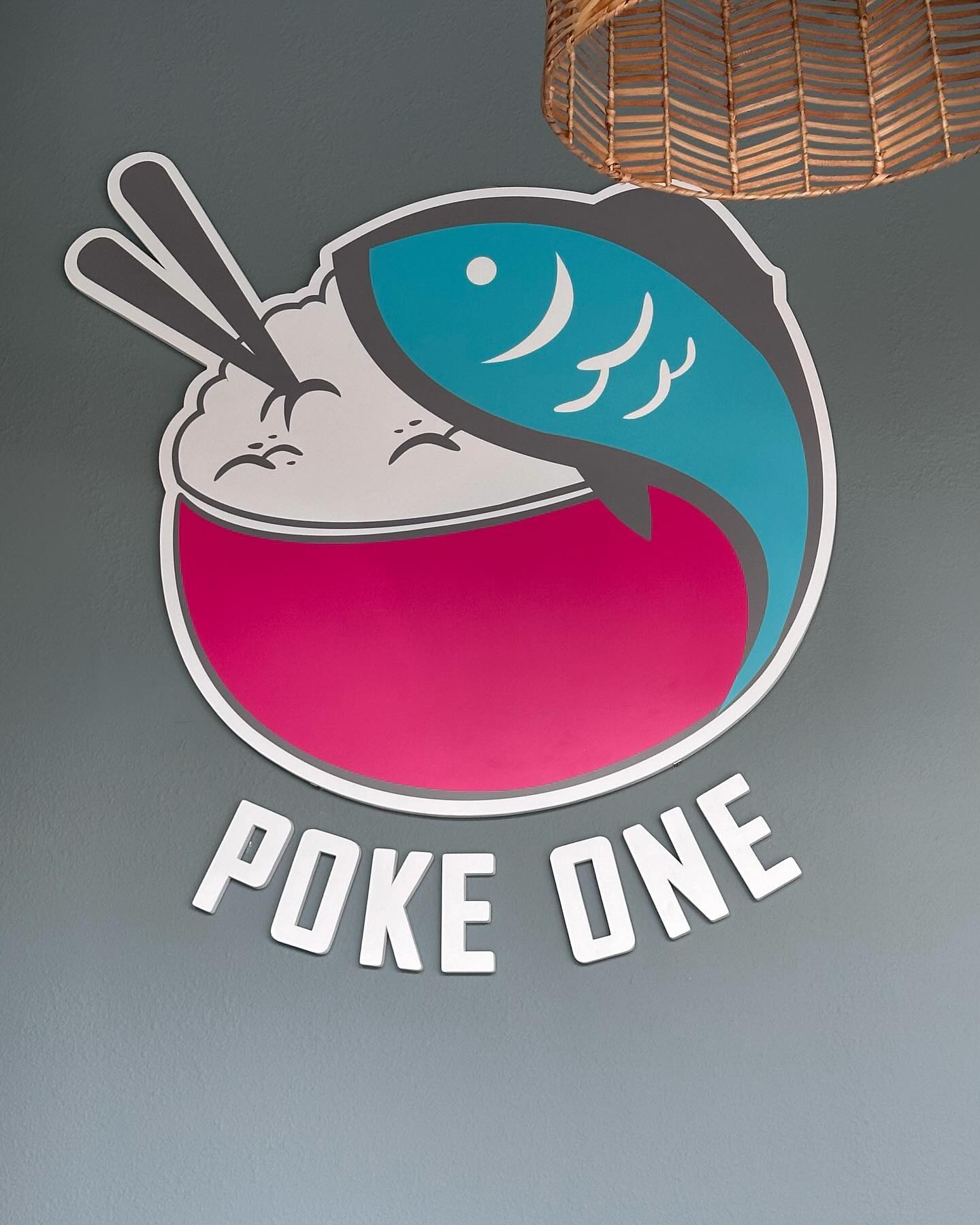 Poke one. Logo sign and wall wraps