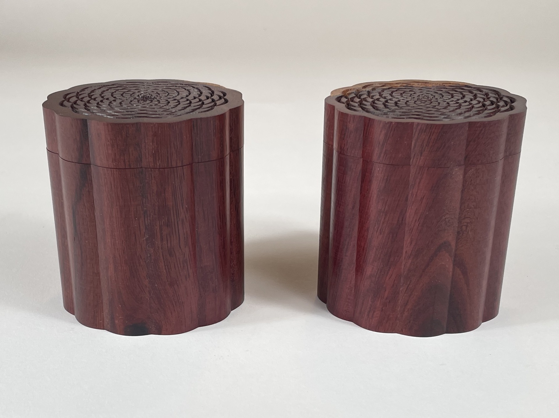 Look a set of twins, a second Fish Scale Box. Being cut from the same piece of Katalox wood it looks near identical. It's noticeable that the top pattern on the first box on the right gets .002" deeper with each row. This second box on the left each scale cut starts shallow then gets to depth in the center of the curve then back to shallow and repeats the same with each row. It's the small details that matter.
#woodturning
#roseengine #ornamentalturning