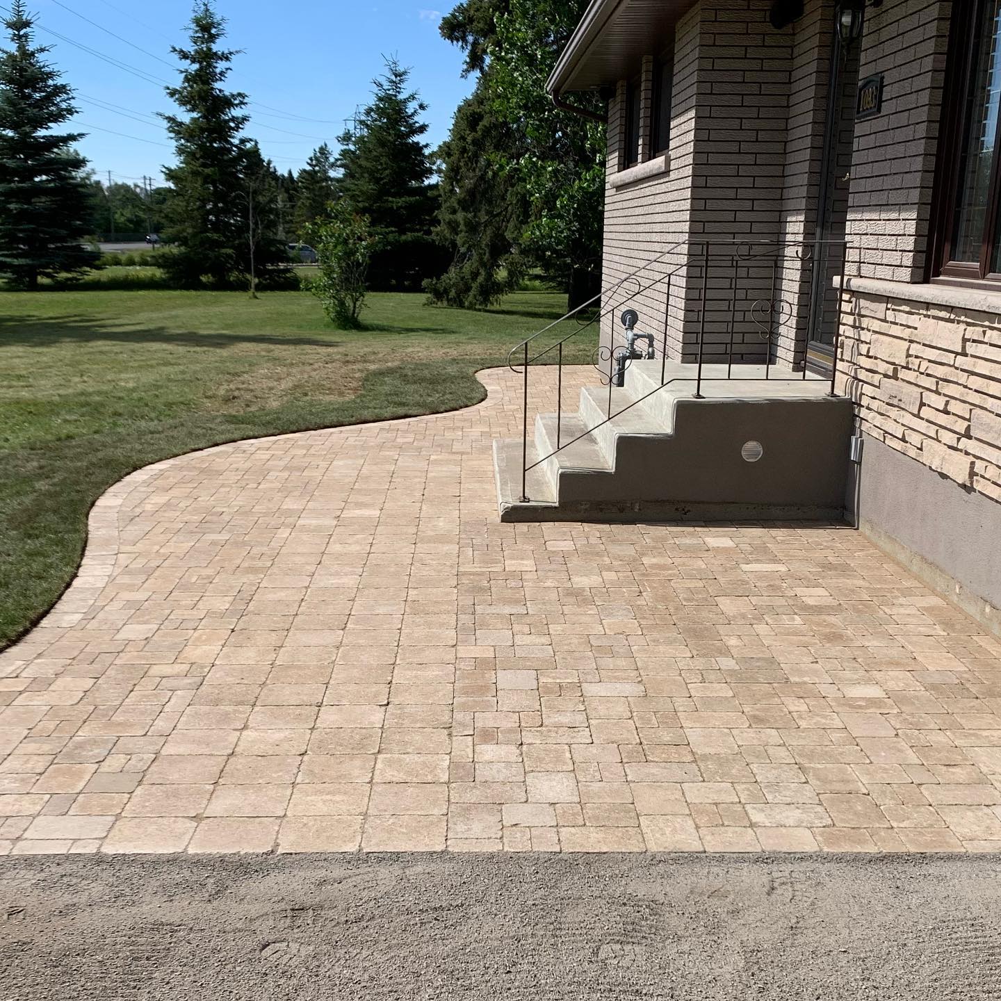 New front entrance/seating area as well as an sidewalk to the back of the house. We were able to reuse the pavers that the customer had installed years ago, we just changed up the layout, added new border stone, and it’s a brand new!